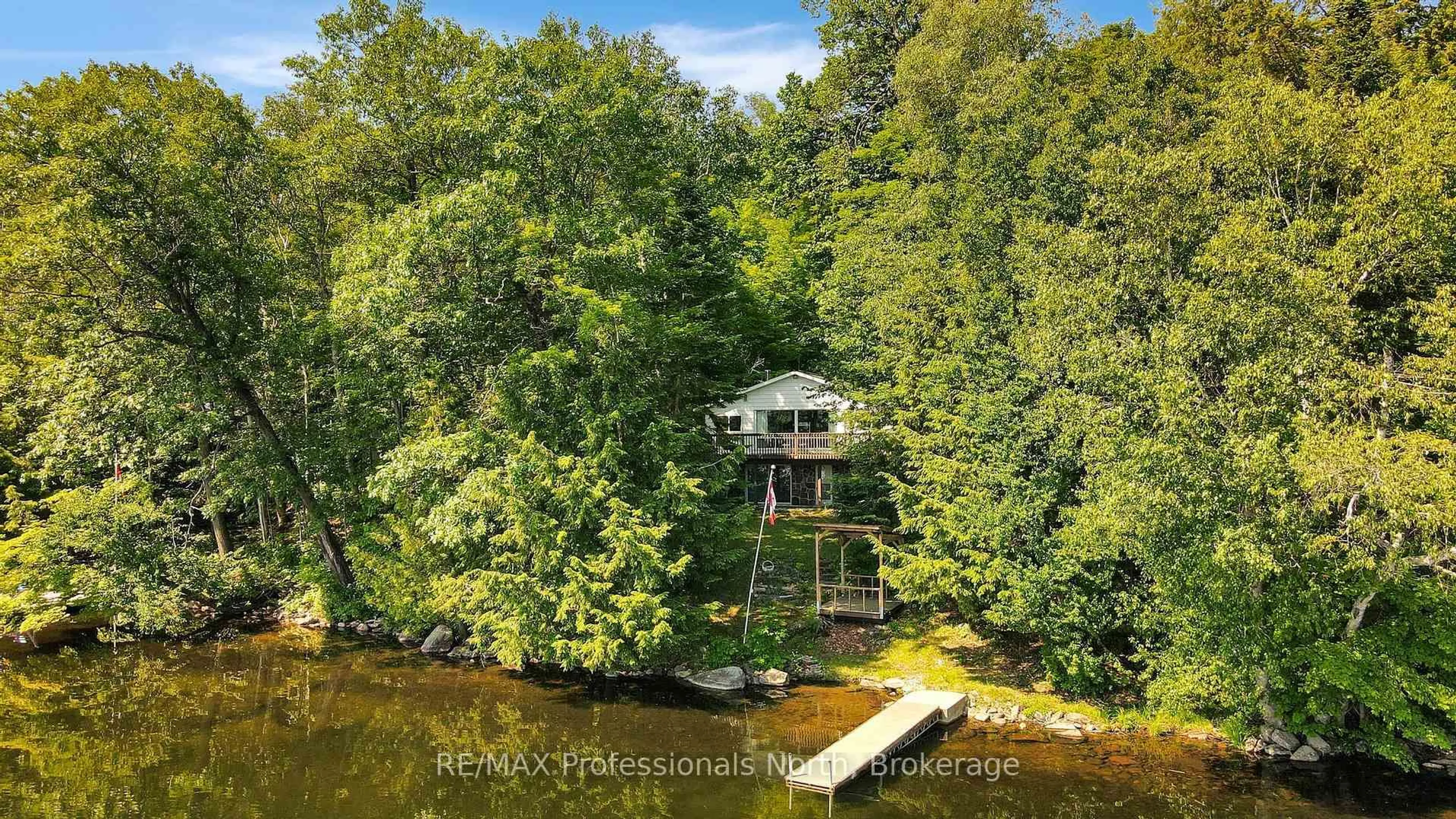 A pic from outside/outdoor area/front of a property/back of a property/a pic from drone, water/lake/river/ocean view for 1005 Mohican Tr, Minden Hills Ontario K0M 1S0