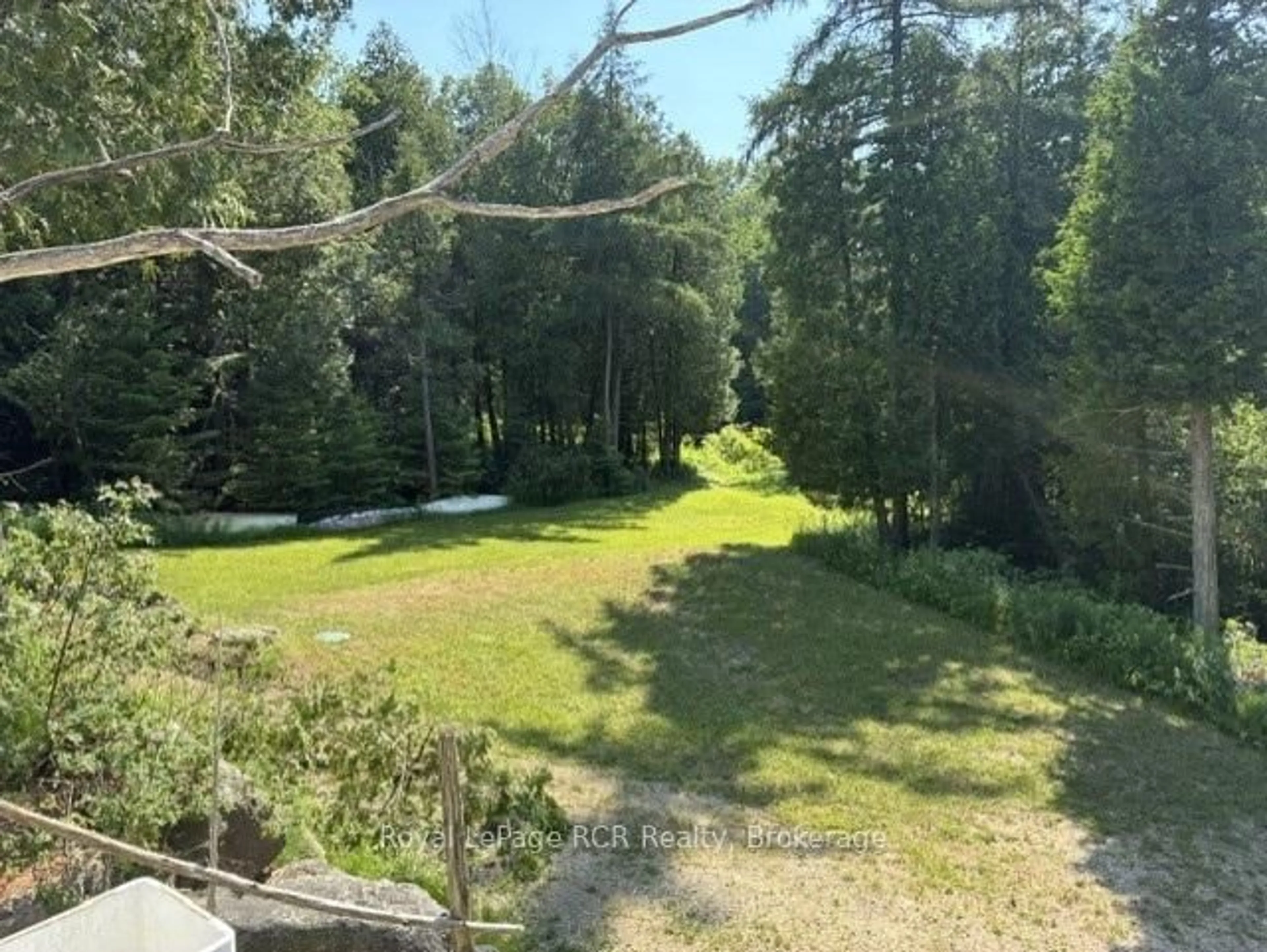 A pic from outside/outdoor area/front of a property/back of a property/a pic from drone, forest/trees view for 19 Redgate Rd, South Bruce Peninsula Ontario N0H 2T0