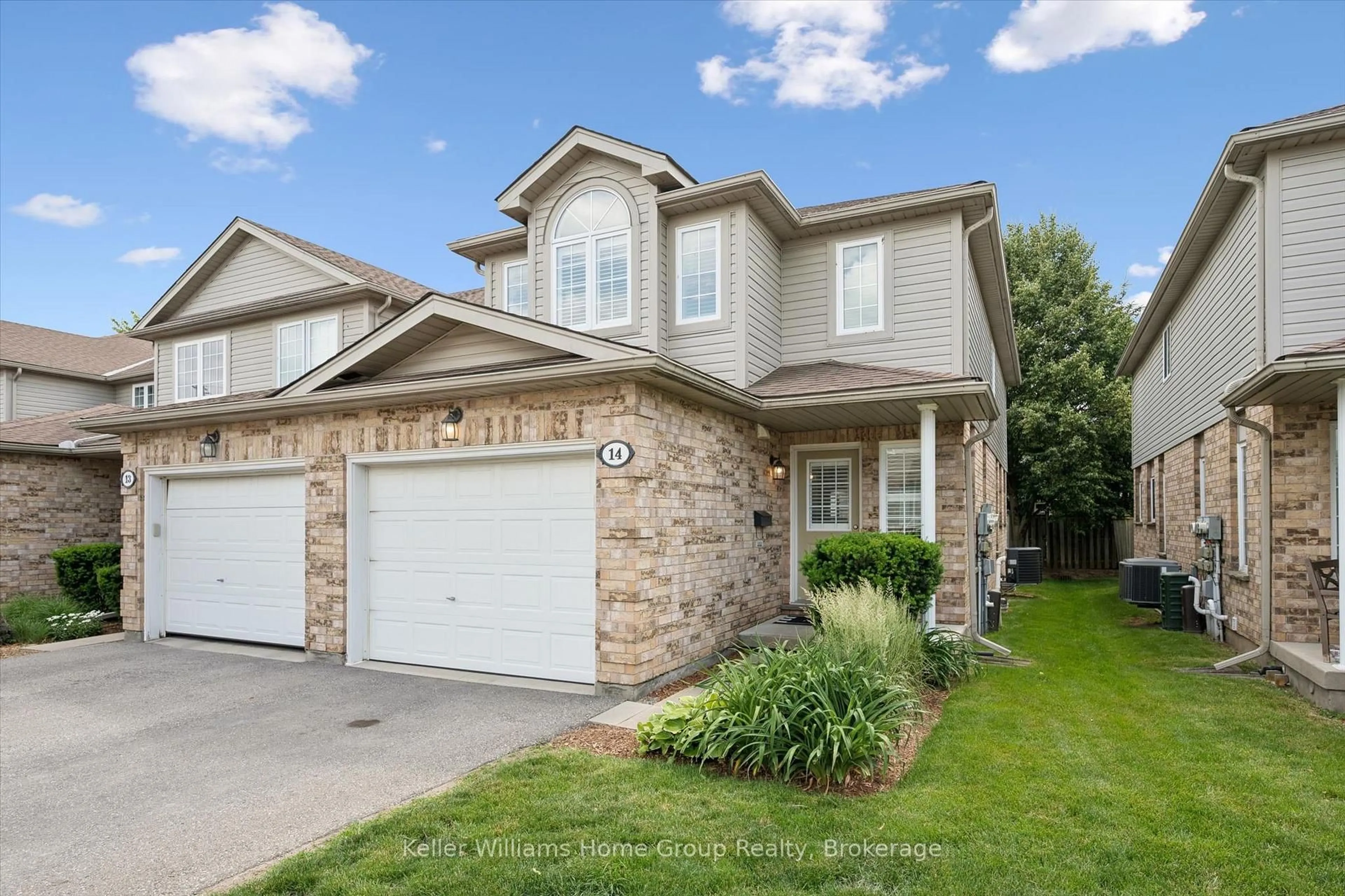 Home with brick exterior material, street for 210 Dawn Ave #14, Guelph Ontario N1G 5L5