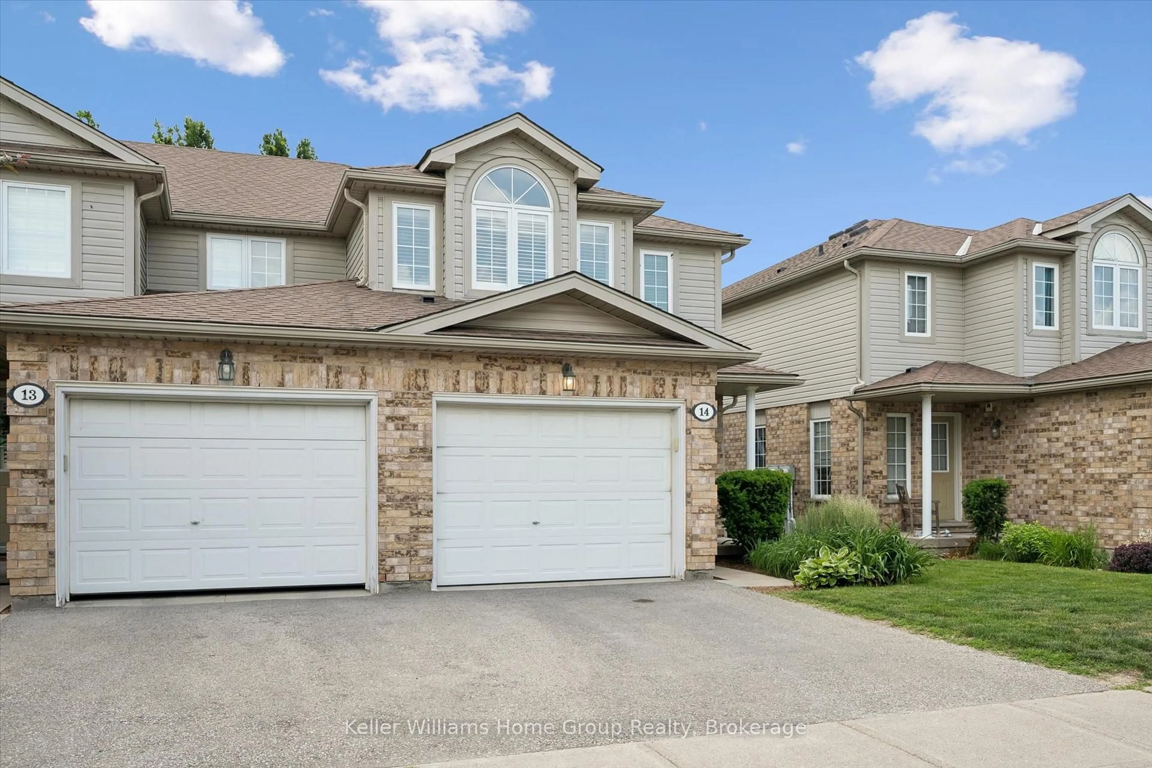 Home with brick exterior material, street for 210 Dawn Ave #14, Guelph Ontario N1G 5L5