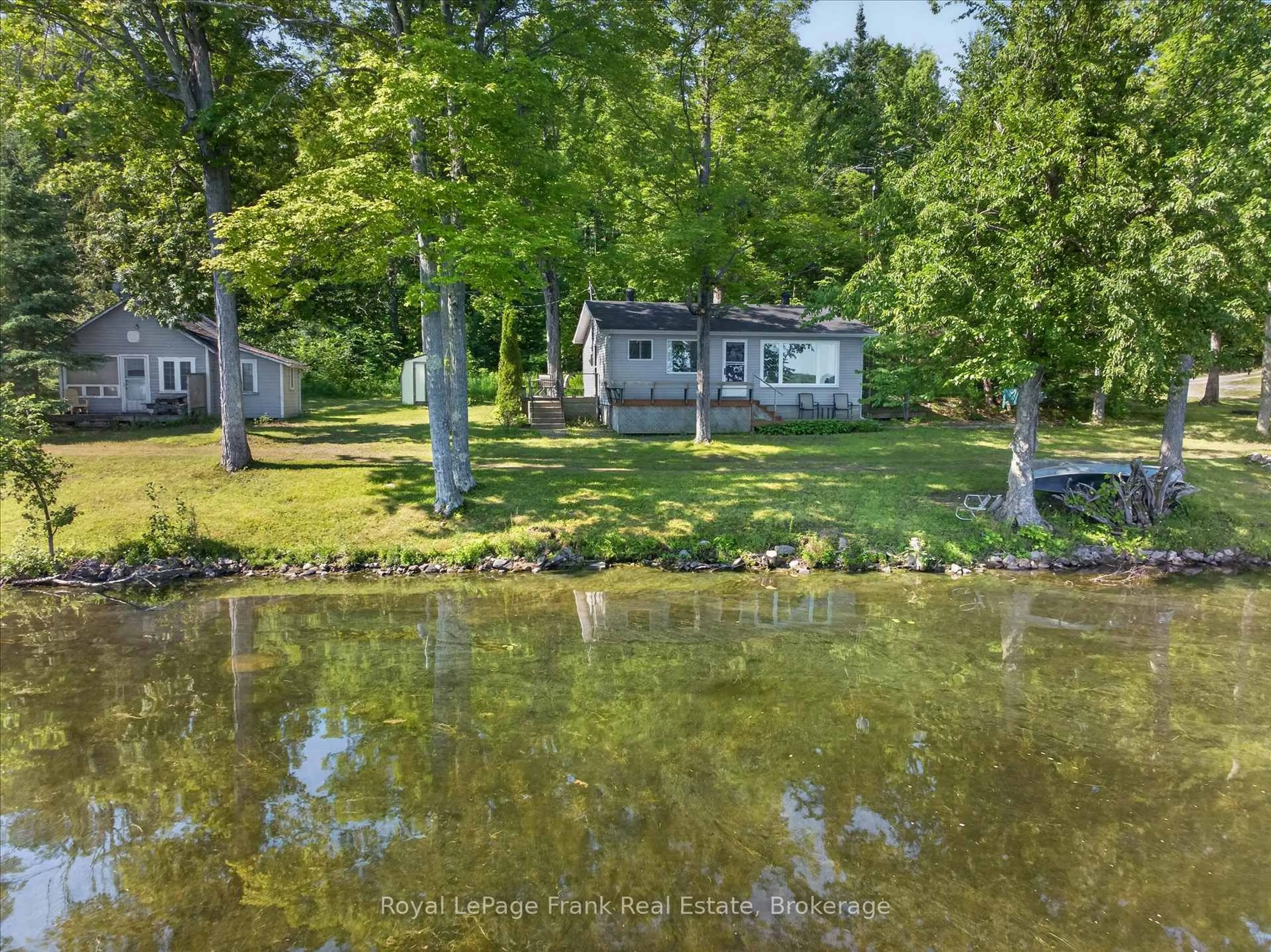 A pic from outside/outdoor area/front of a property/back of a property/a pic from drone, water/lake/river/ocean view for 2310 Armstrong Lane, Selwyn Ontario K0L 2H0