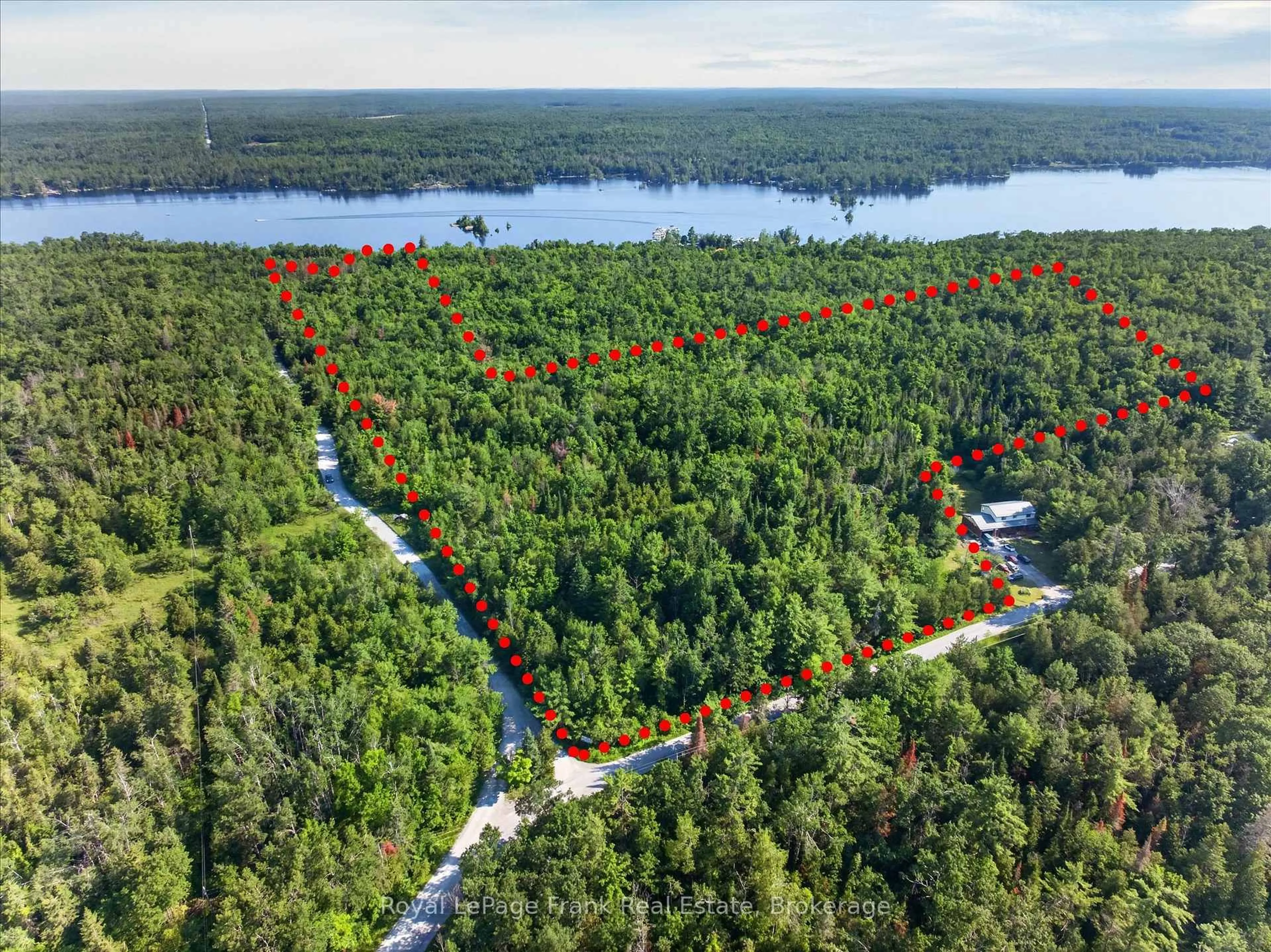 A pic from outside/outdoor area/front of a property/back of a property/a pic from drone, water/lake/river/ocean view for 2310 Armstrong Lane, Selwyn Ontario K0L 2H0