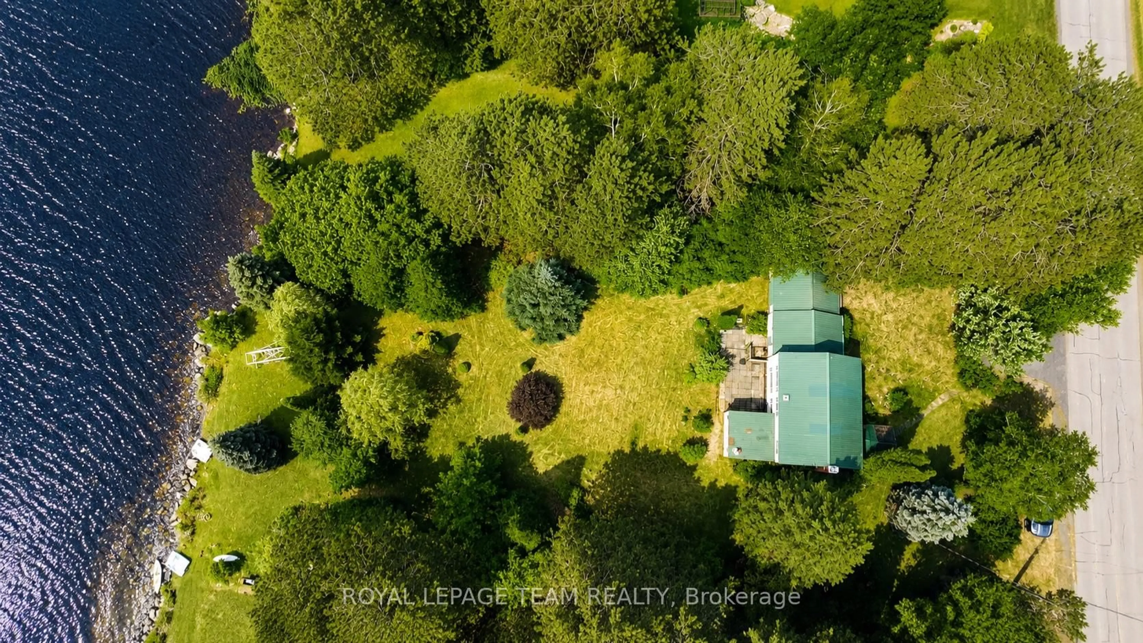 A pic from outside/outdoor area/front of a property/back of a property/a pic from drone, forest/trees view for 112 Ottawa St, South Algonquin Ontario K0J 2M0