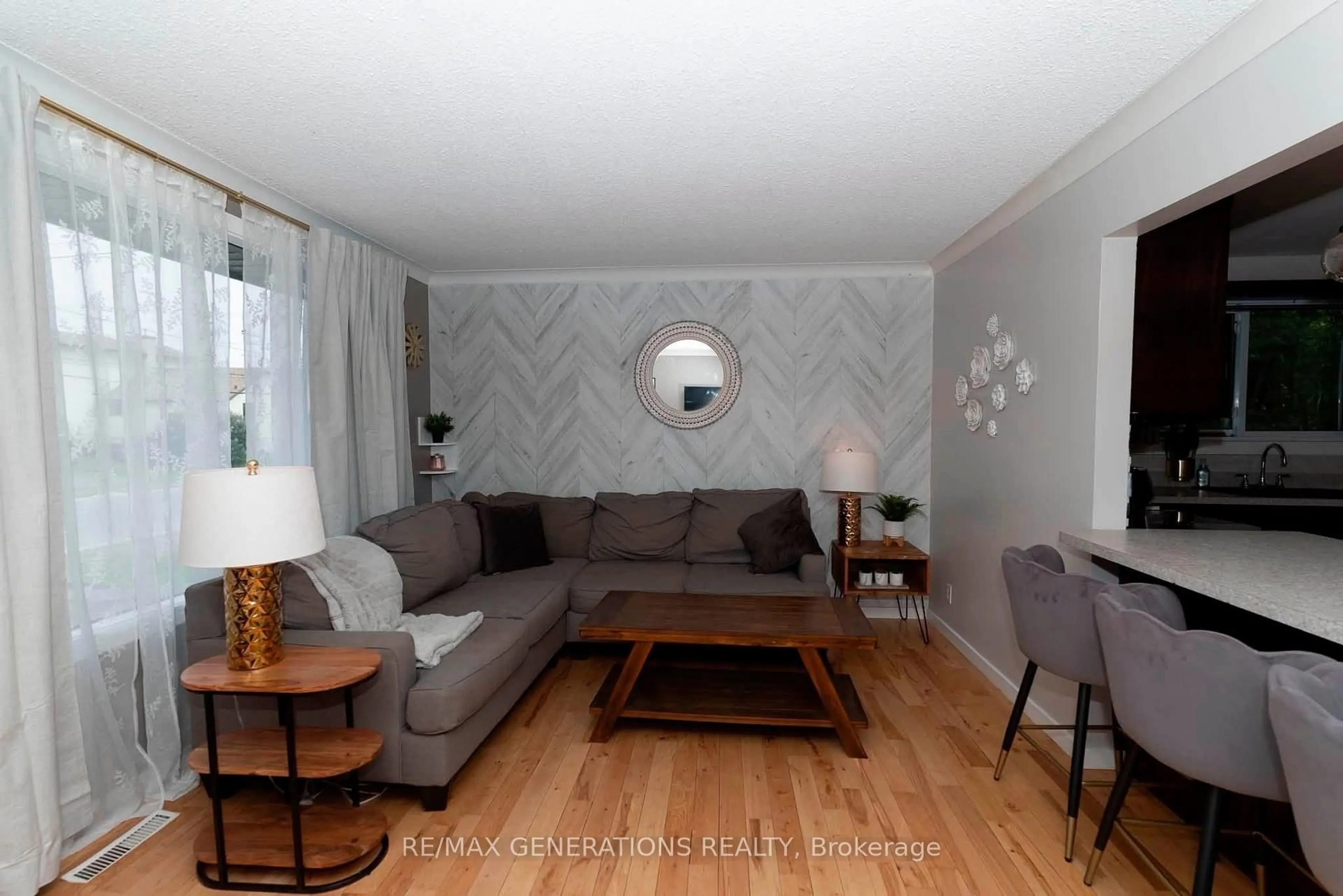Living room with furniture, wood/laminate floor for 473 Tupper St, Thunder Bay Ontario P7A 3Z5