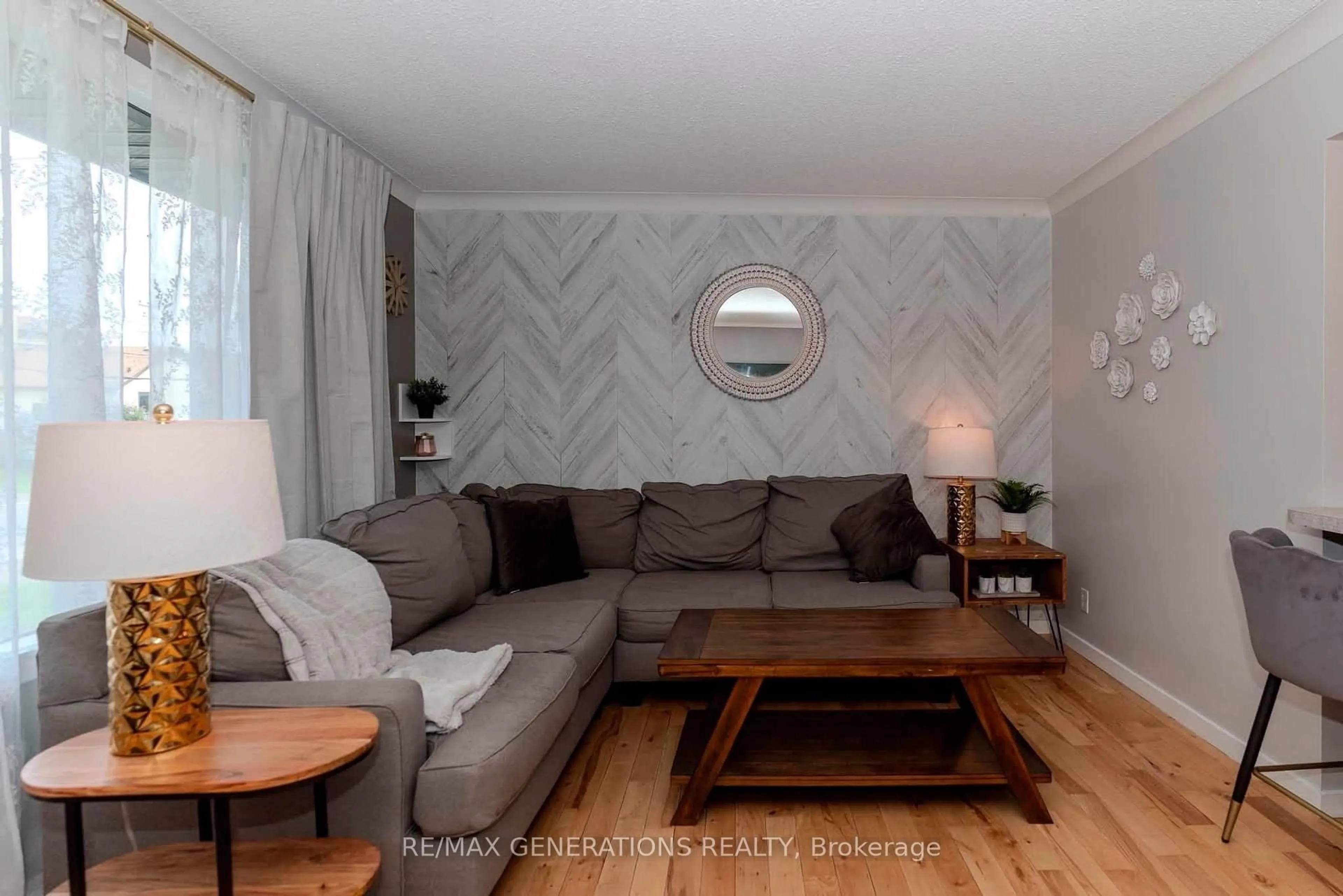 Living room with furniture, wood/laminate floor for 473 Tupper St, Thunder Bay Ontario P7A 3Z5