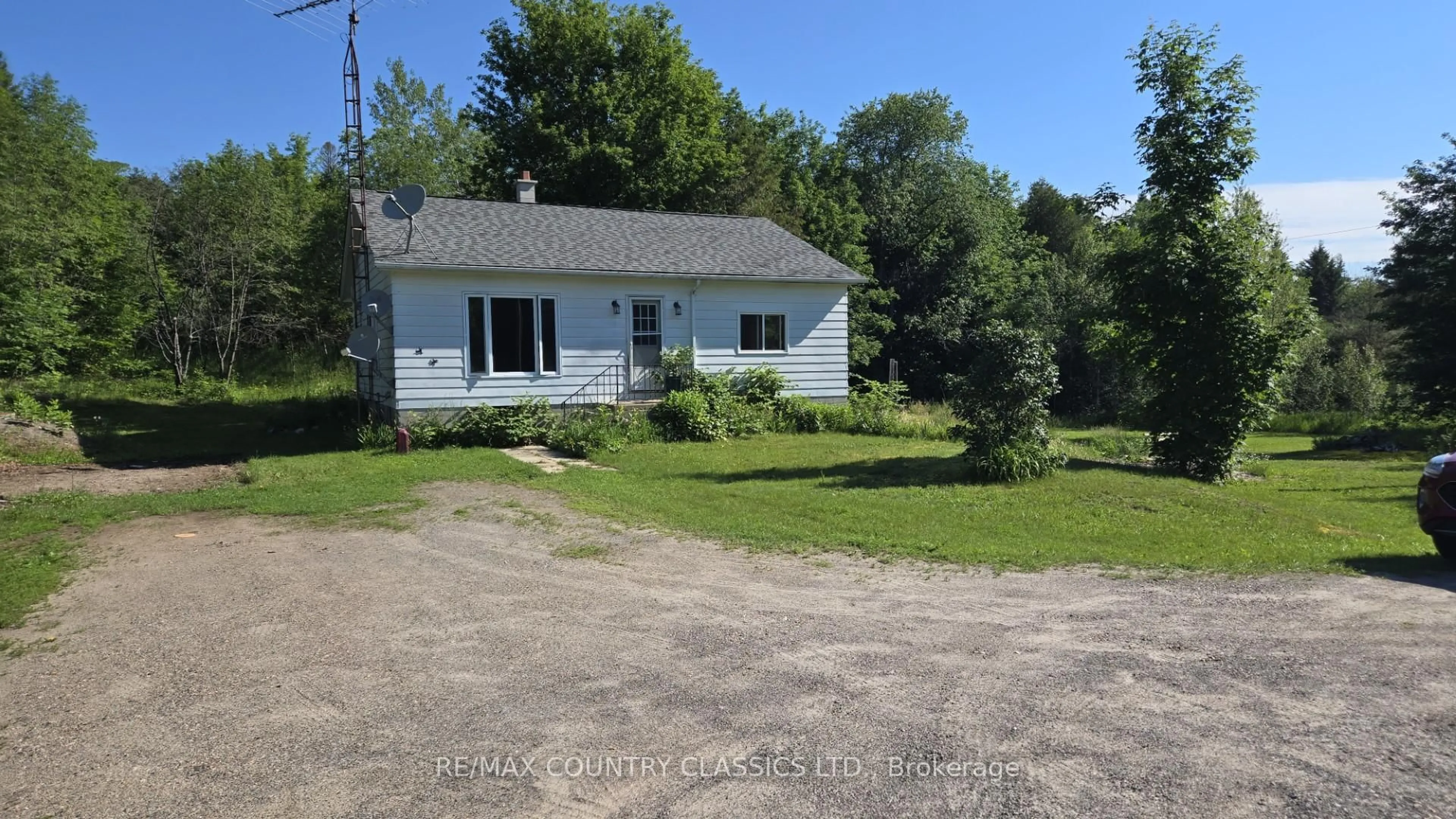 A pic from outside/outdoor area/front of a property/back of a property/a pic from drone, street for 7118 Highway 620, Coe Hill Ontario K0L 1P0