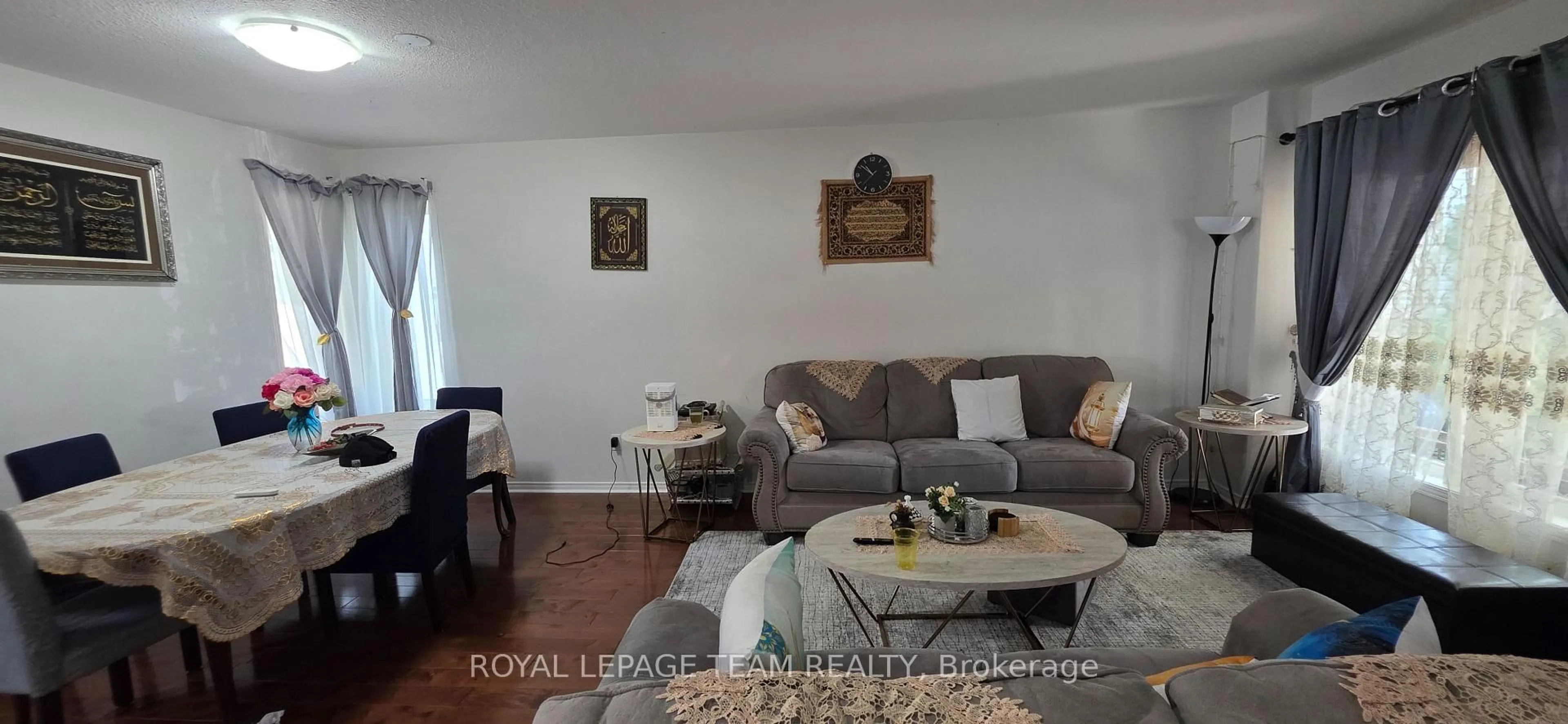 Living room with furniture, wood/laminate floor for 175 Mountshannon Dr, Ottawa Ontario K2J 4M9