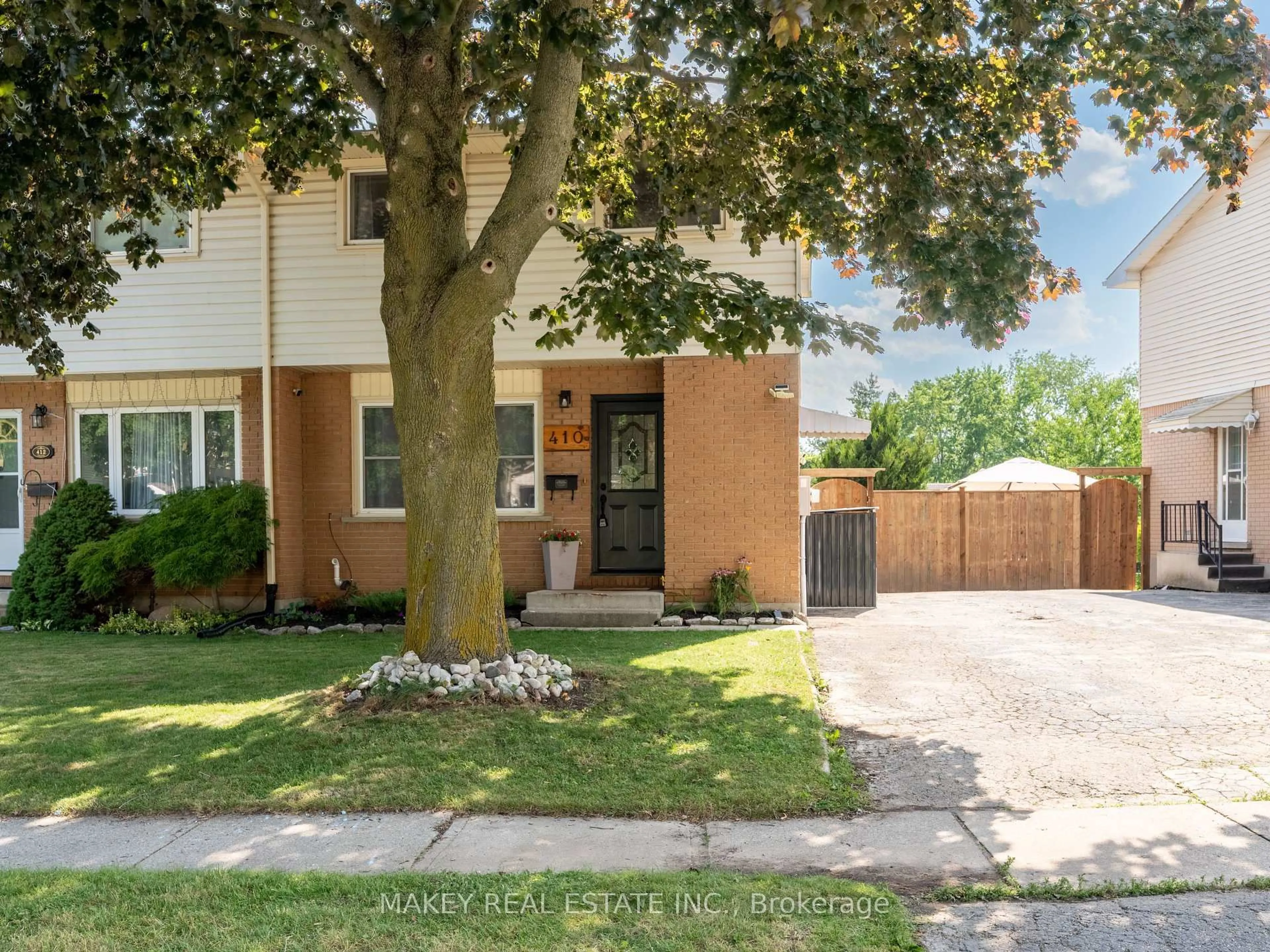 Home with brick exterior material, street for 410 Odlum Dr, Woodstock Ontario N4S 3S2