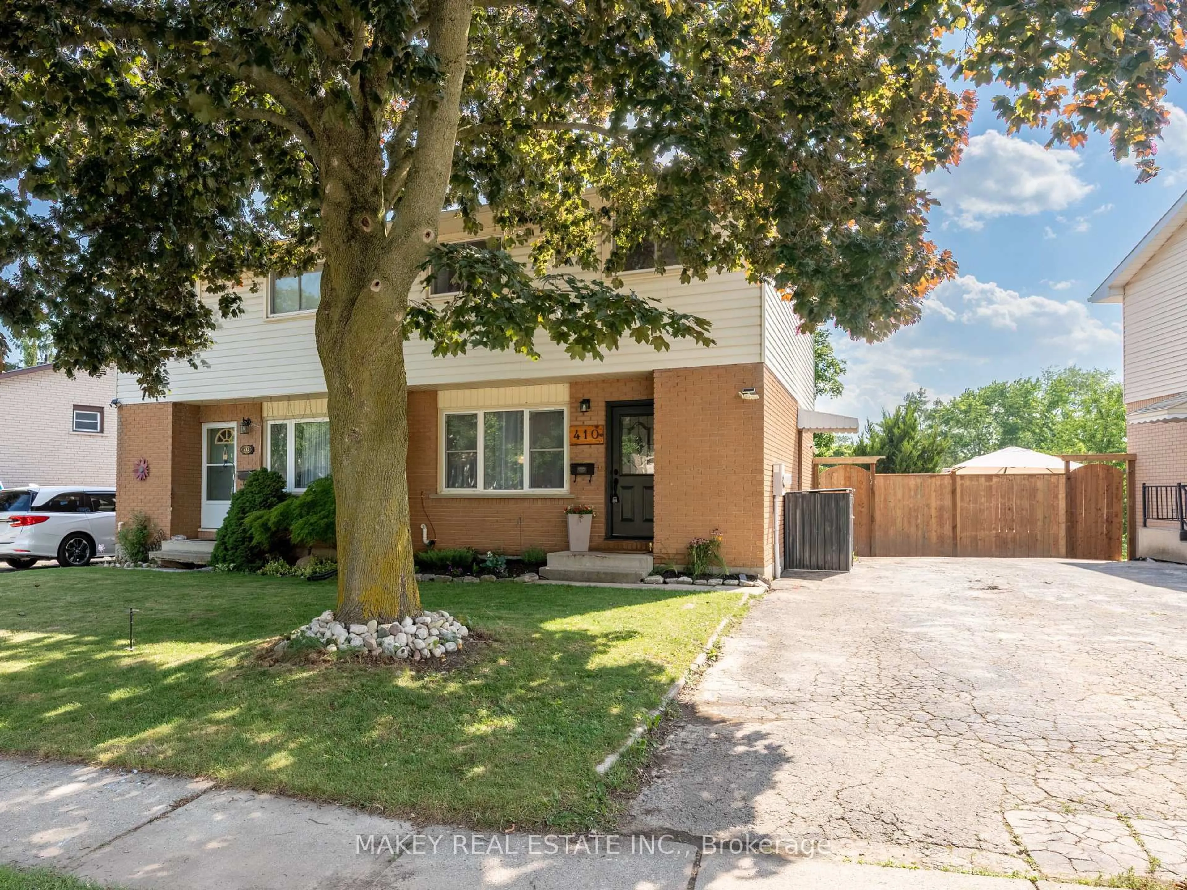 Home with brick exterior material, street for 410 Odlum Dr, Woodstock Ontario N4S 3S2