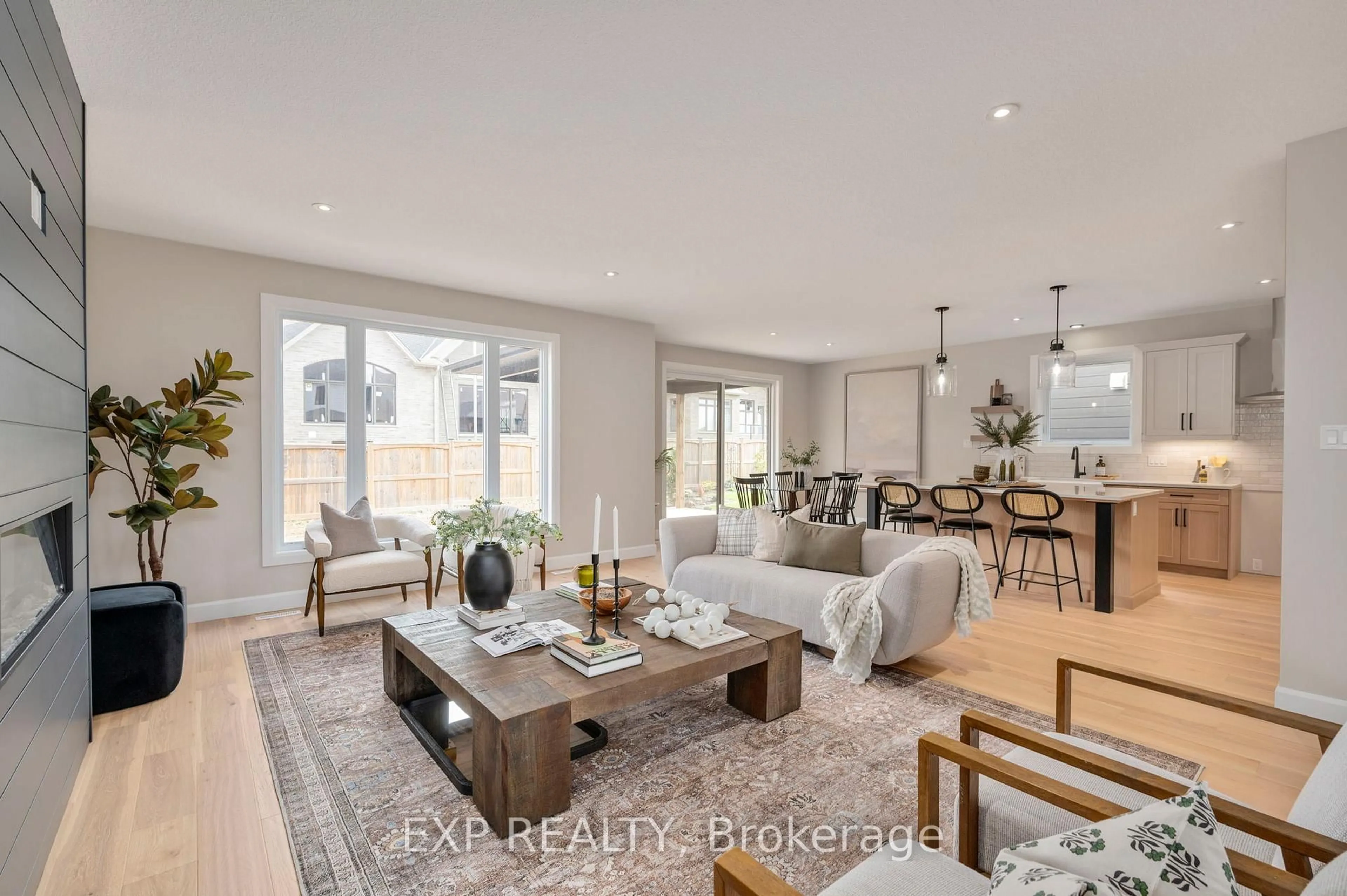 Living room with furniture, wood/laminate floor for Lot 2 Sunningdale Crt, London North Ontario N6G 3Z7