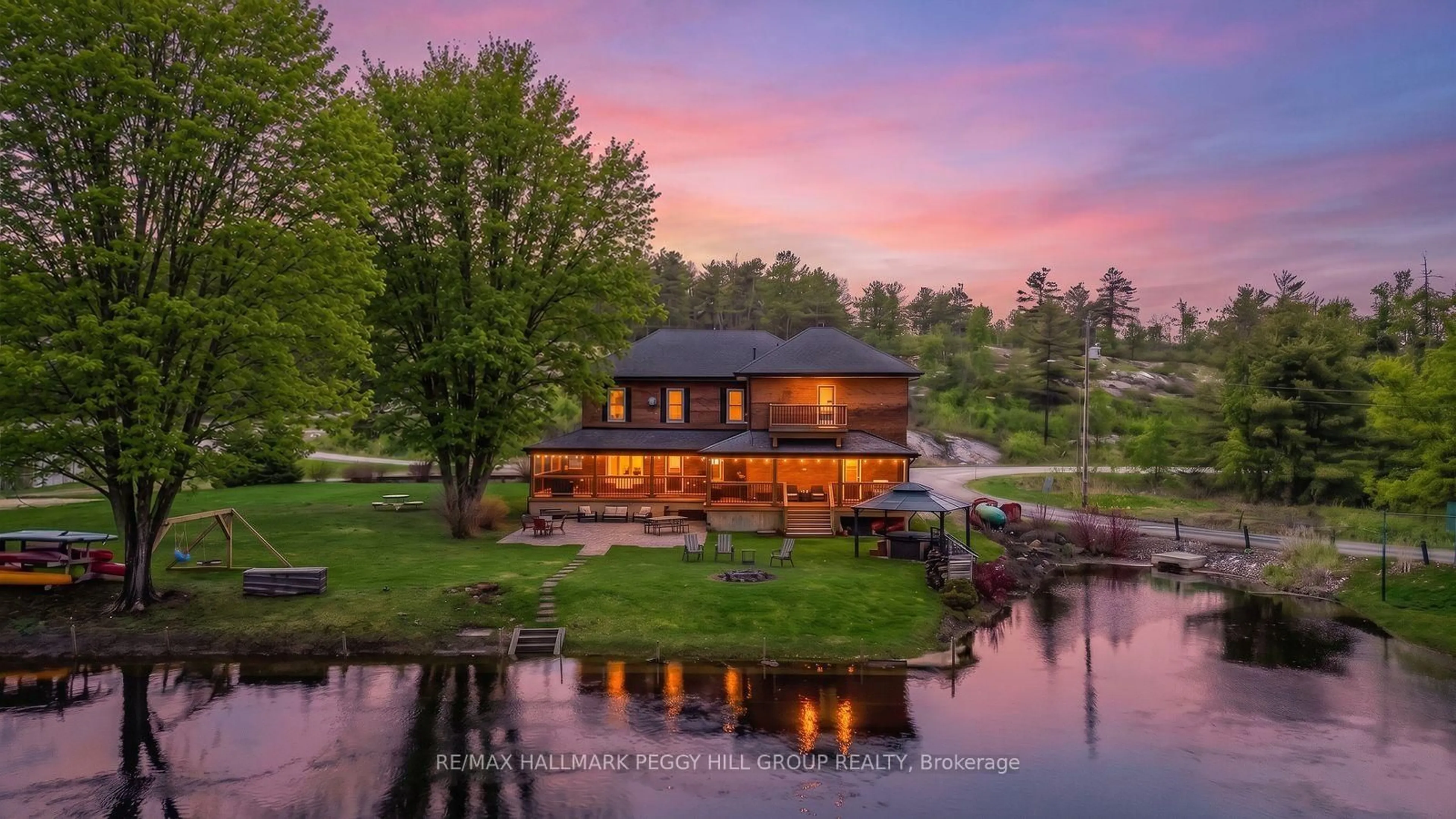 A pic from outside/outdoor area/front of a property/back of a property/a pic from drone, water/lake/river/ocean view for 1002 Cowbell Lane, Gravenhurst Ontario P0E 1N0
