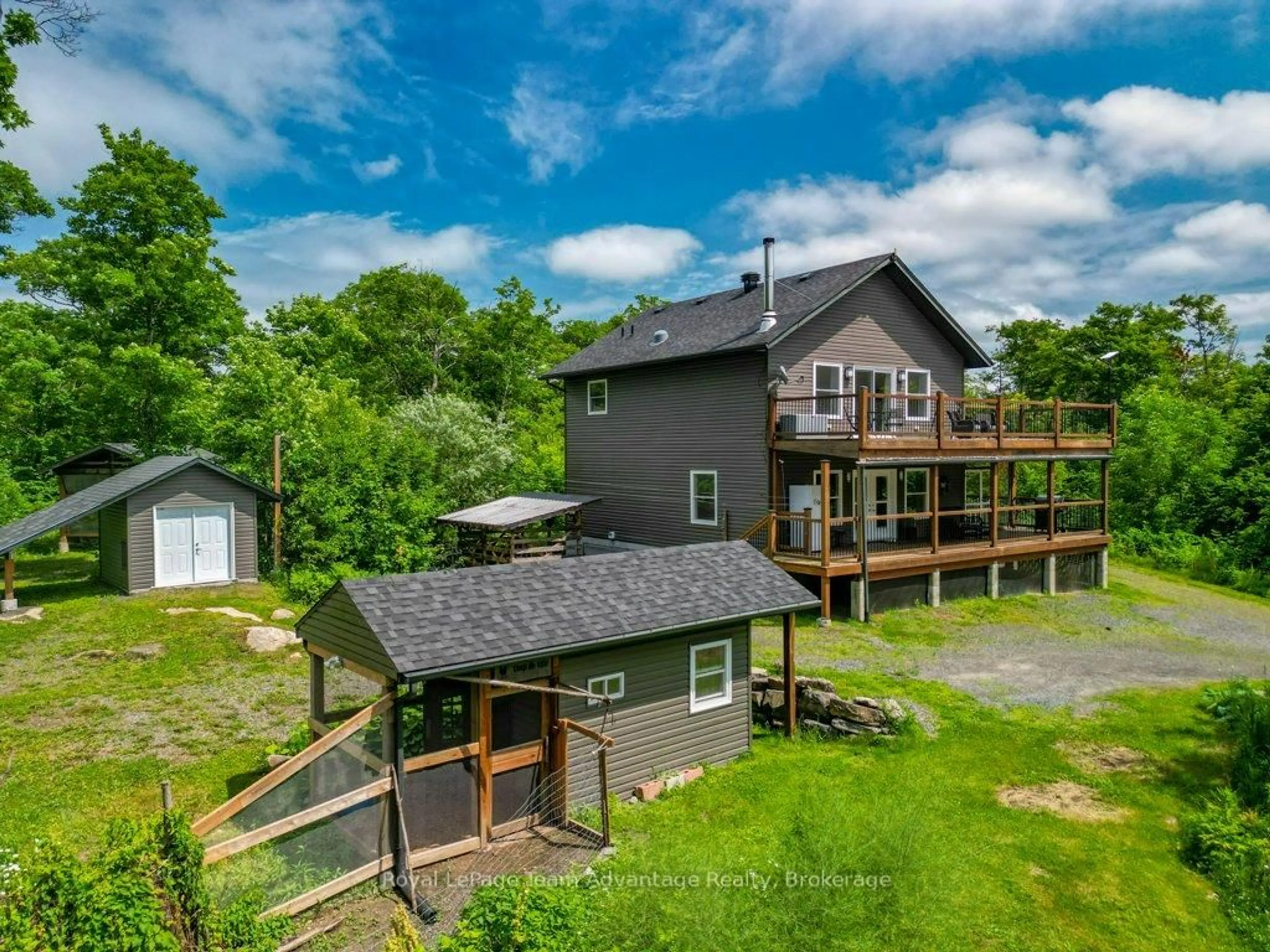 A pic from outside/outdoor area/front of a property/back of a property/a pic from drone, water/lake/river/ocean view for 558 518 Highway, Seguin Ontario P2A 0B2