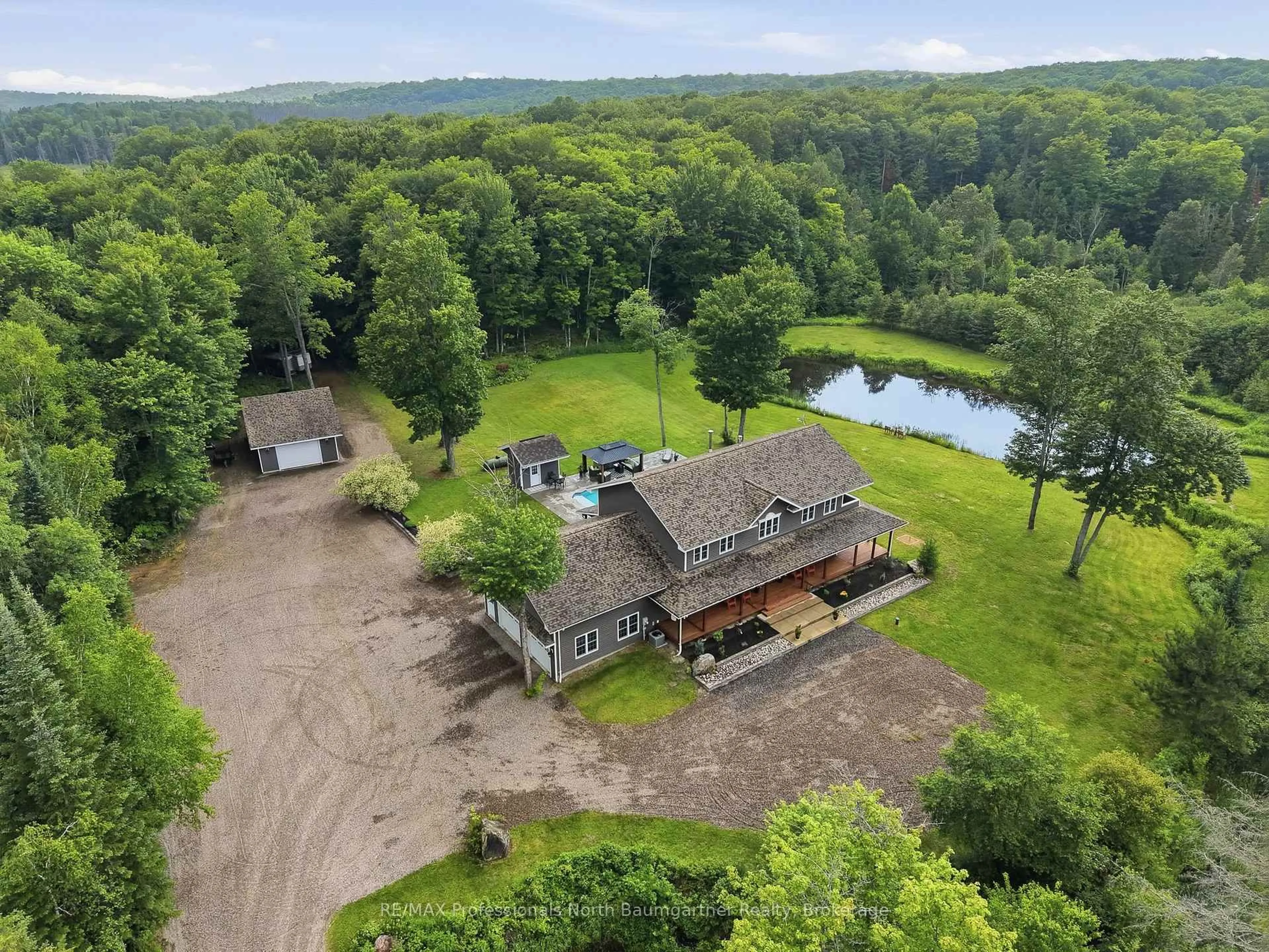 A pic from outside/outdoor area/front of a property/back of a property/a pic from drone, water/lake/river/ocean view for 12688 Highway 118, Dysart et al Ontario K0M 1S0