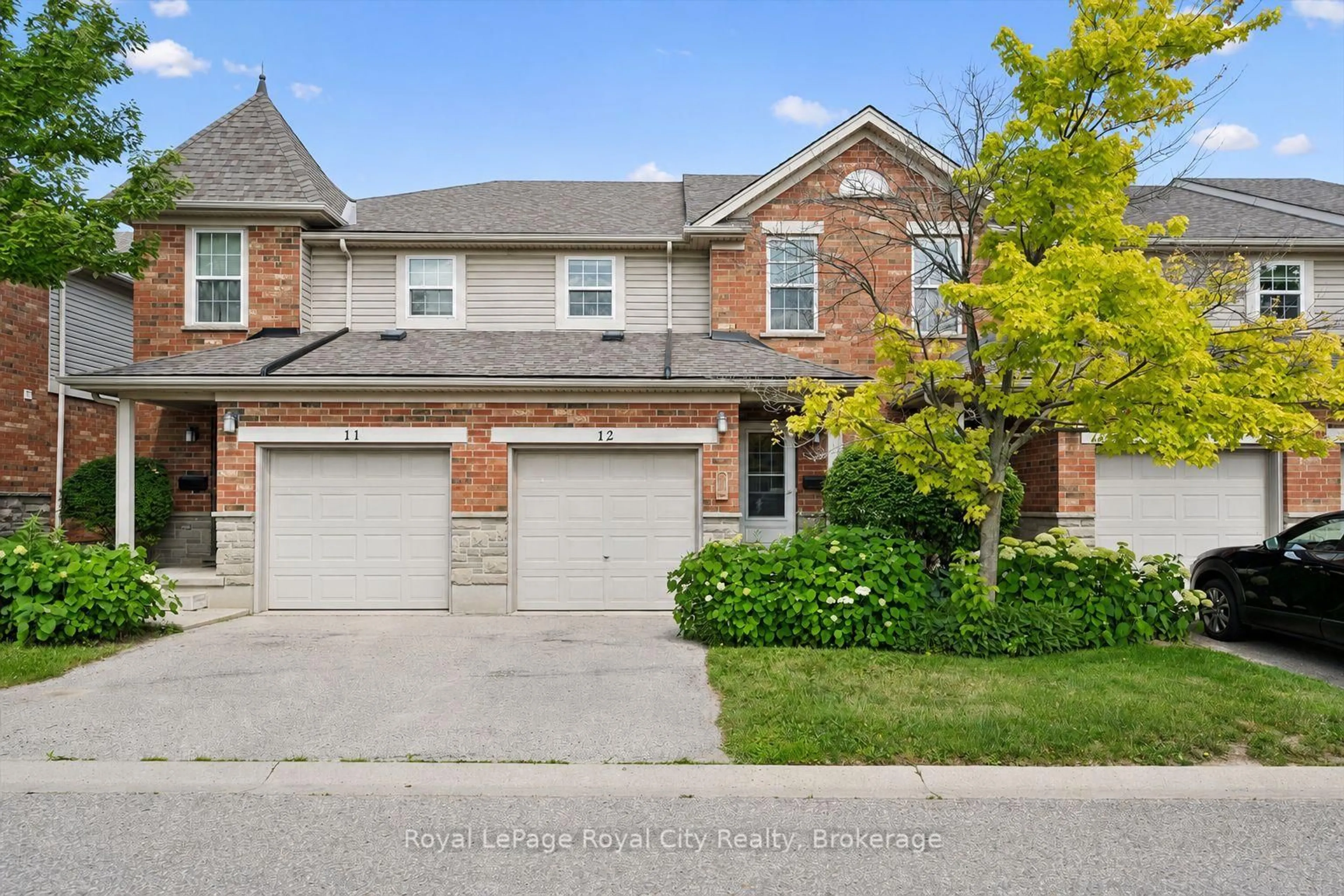 Home with brick exterior material, street for 124 Gosling Gdns ##12, Guelph Ontario N1G 5K6