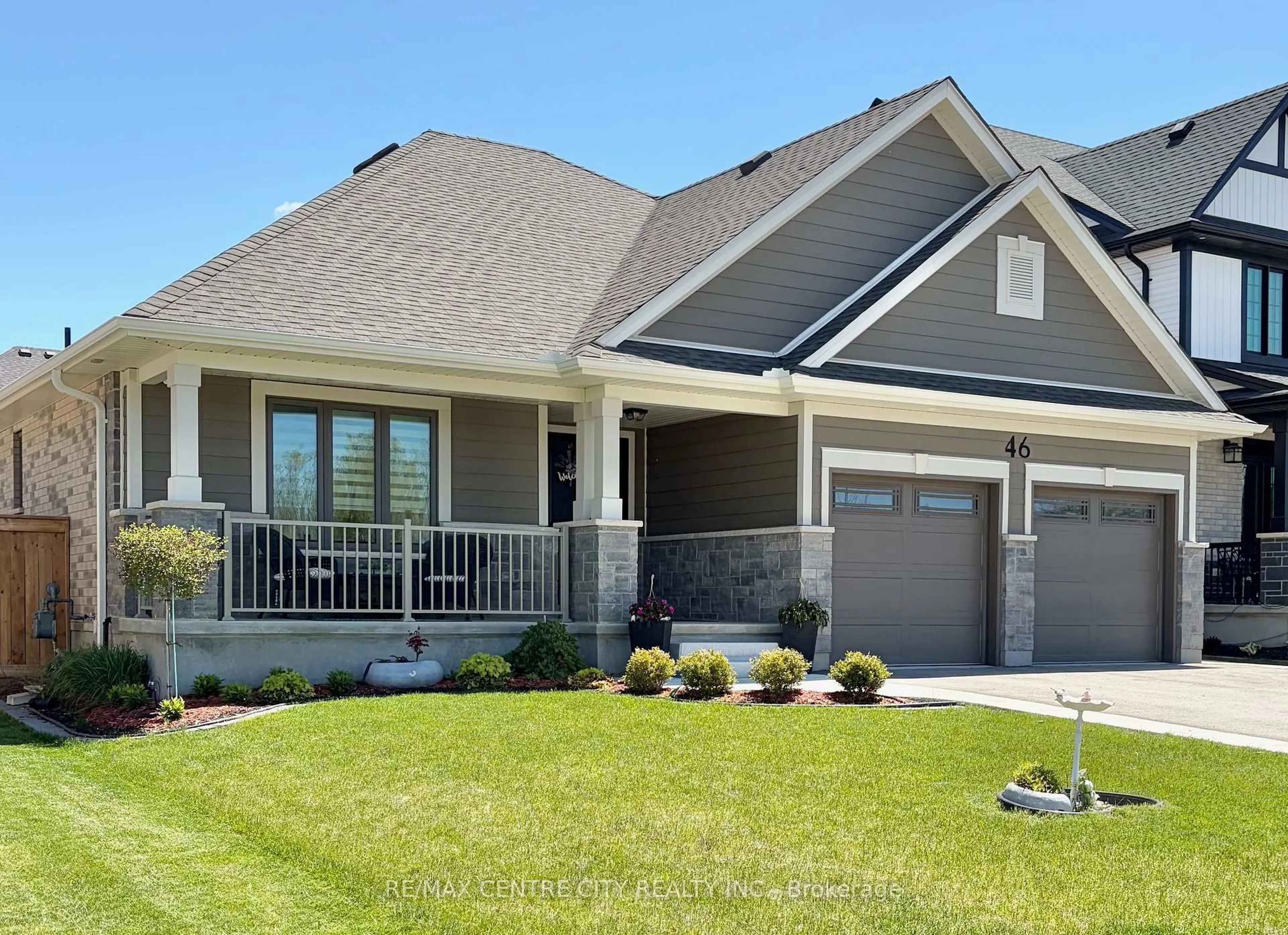 Home with vinyl exterior material, street for 46 Snowy Owl Tr, Central Elgin Ontario N5R 0M6