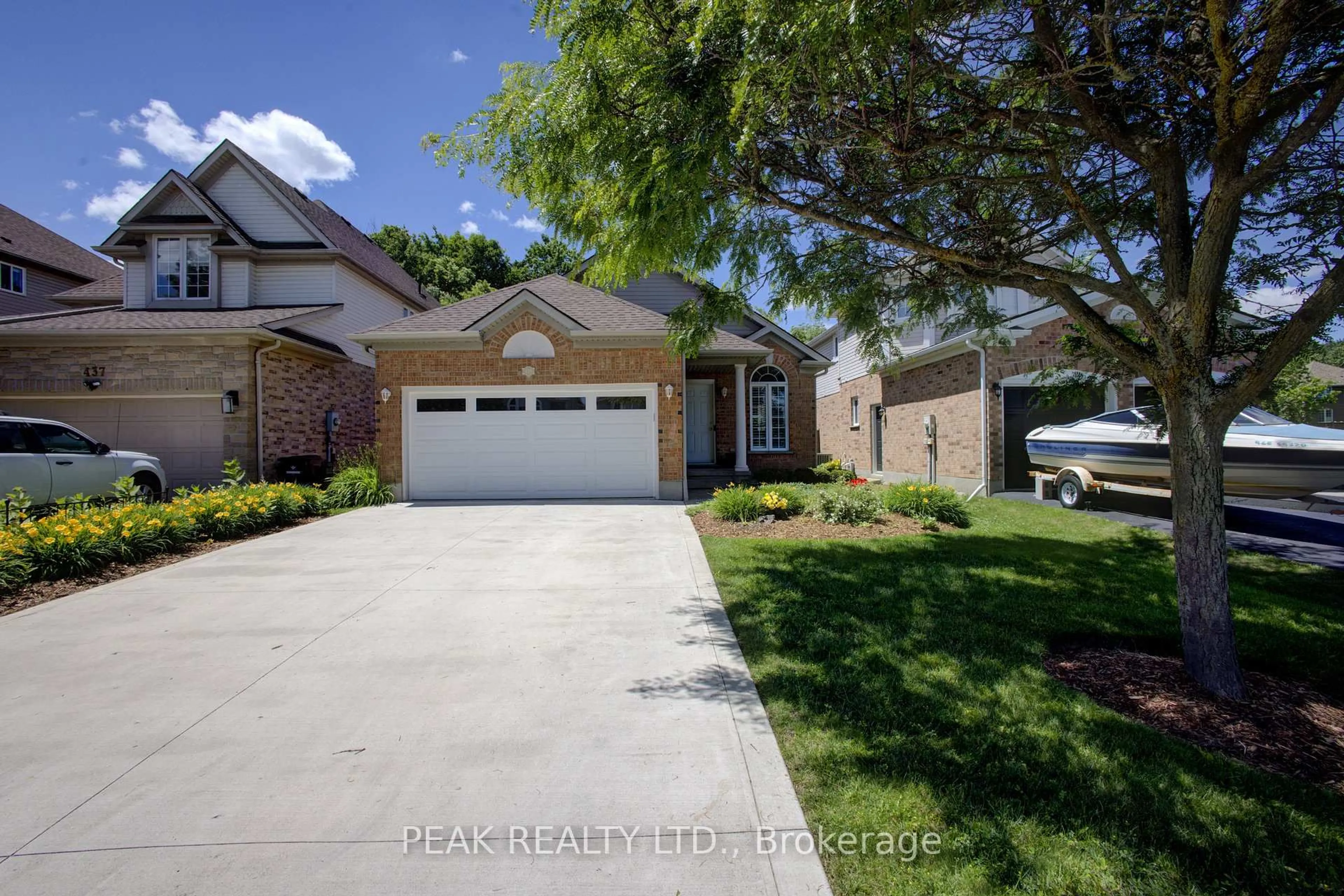 Home with brick exterior material, street for 439 Woodrow Dr, Waterloo Ontario N2T 2V6