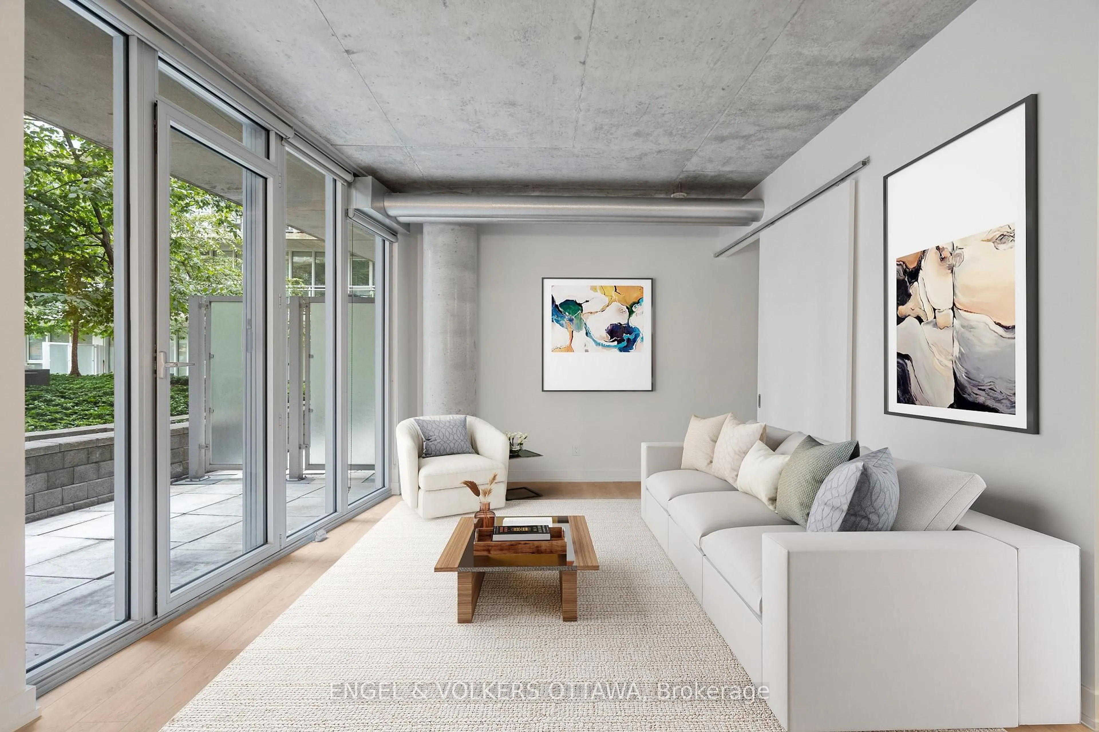 Living room with furniture, cement floor for 354 Gladstone Ave #205, Ottawa Ontario K2P 0R4