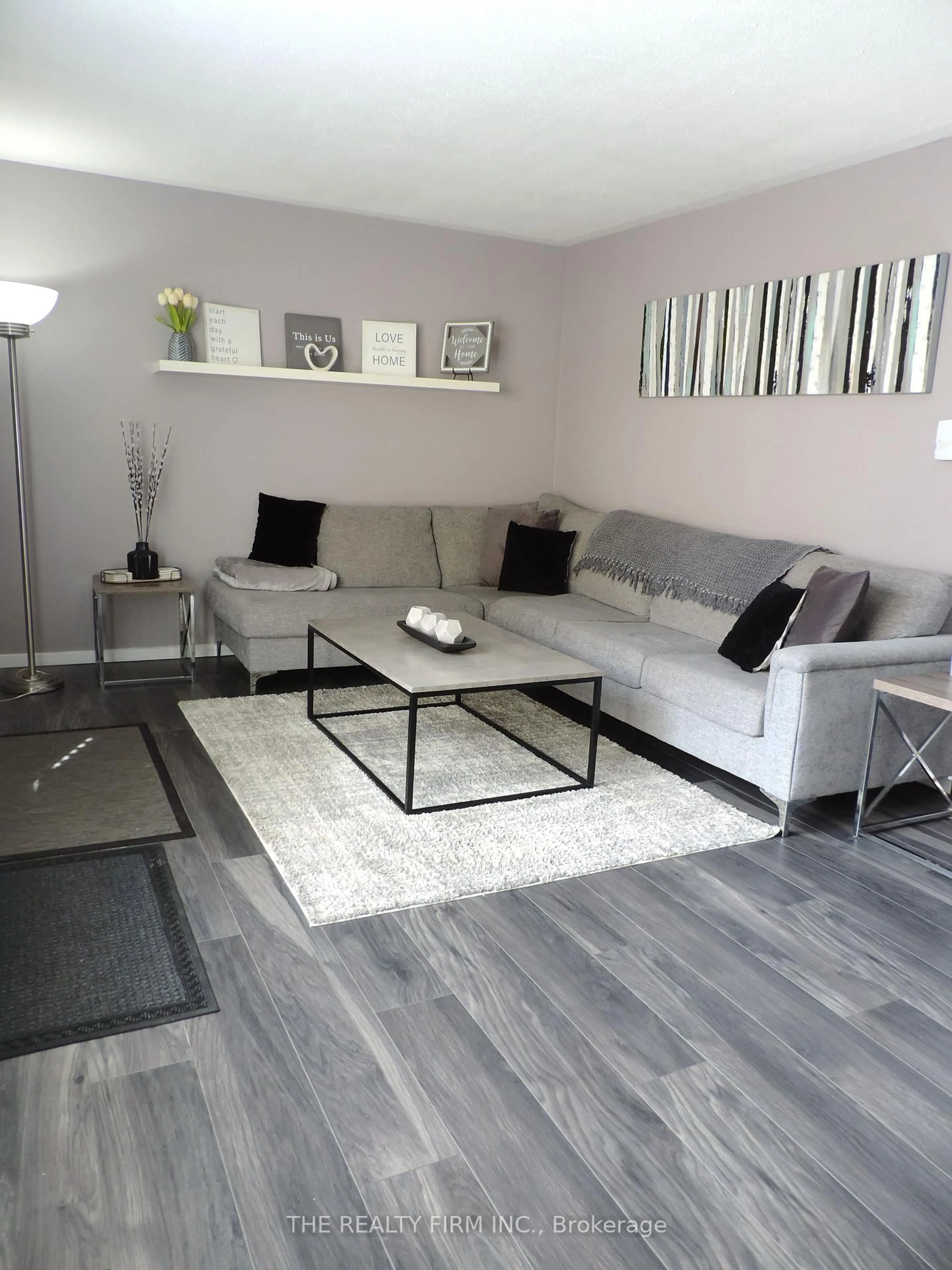 Living room with furniture, wood/laminate floor for 474 Southdale Rd #33, London South Ontario N6E 1A4