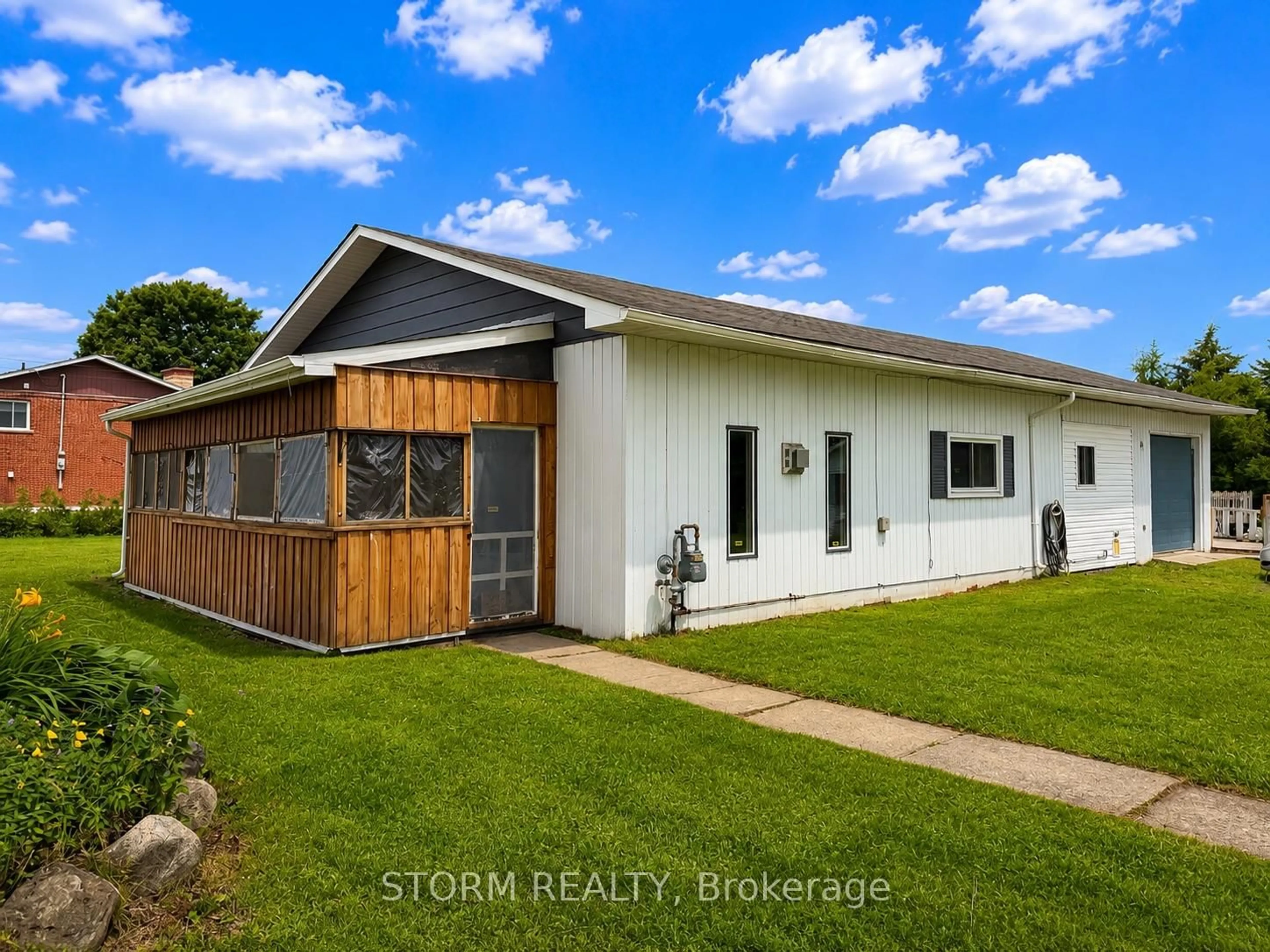 Home with vinyl exterior material, street for 5560 Avonmore Rd, South Stormont Ontario K0C 1P0