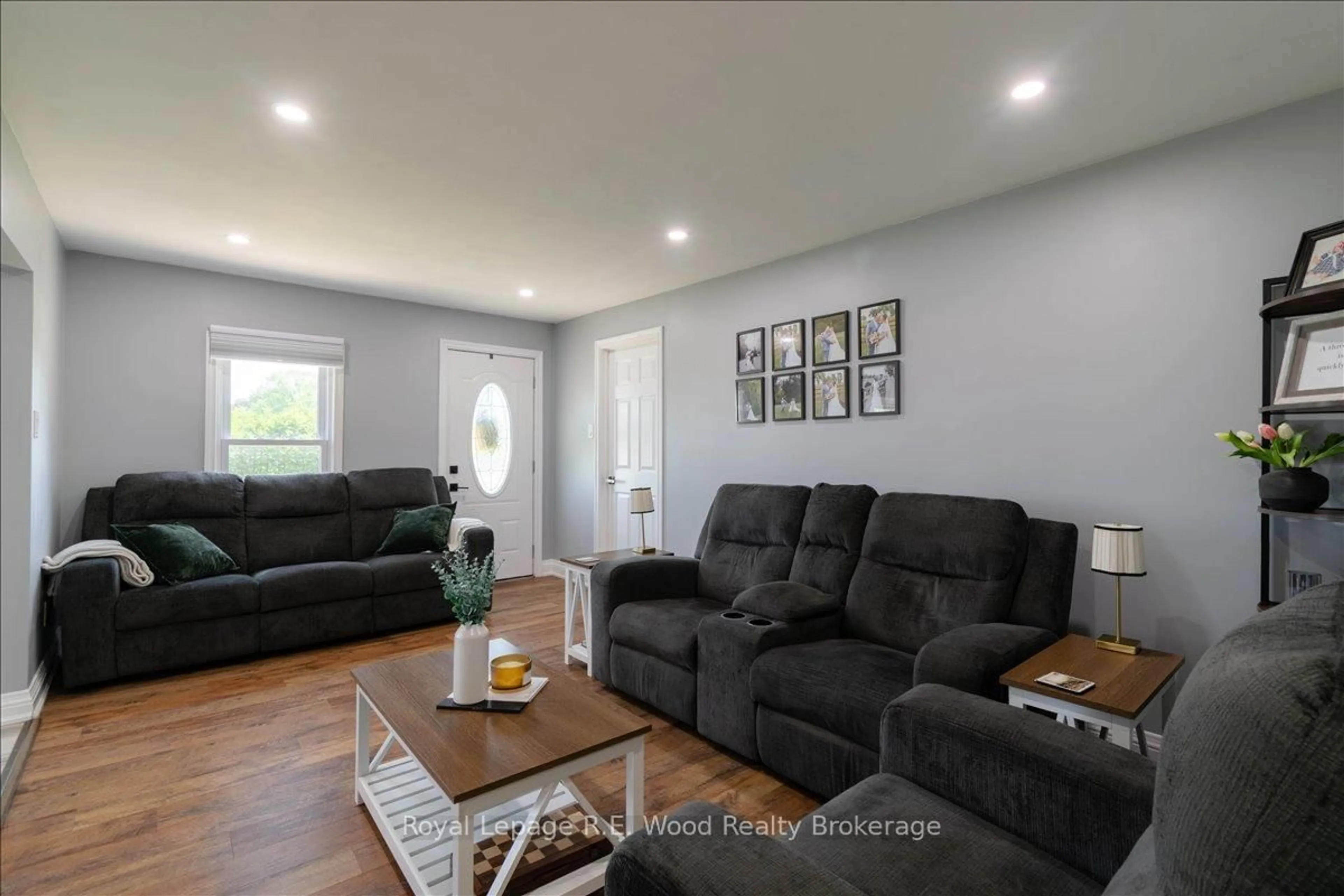 Living room with furniture, wood/laminate floor for 477 Church St, Norfolk Ontario N4B 1V2