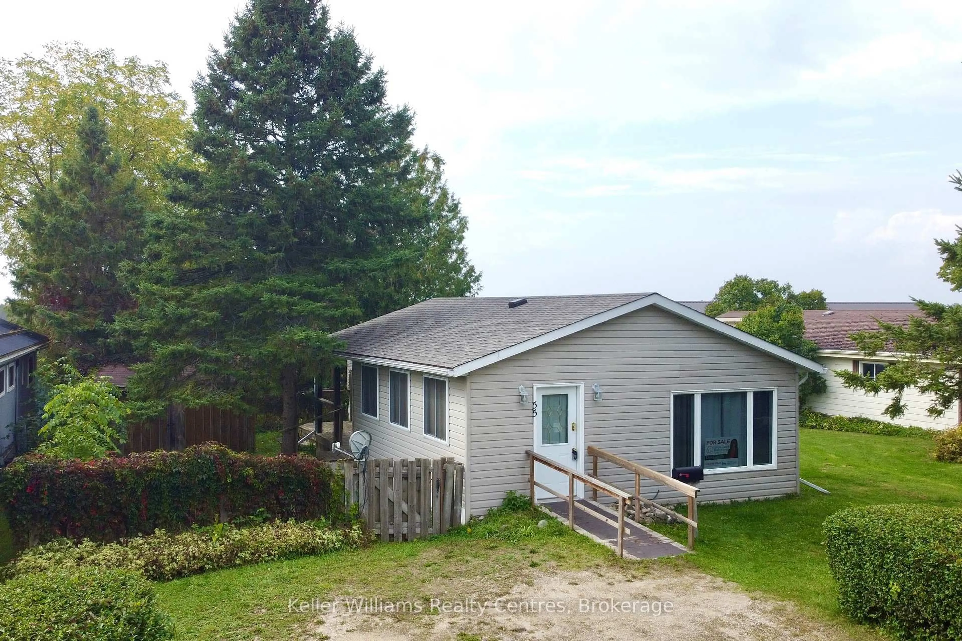 A pic from outside/outdoor area/front of a property/back of a property/a pic from drone, unknown for 302694 Douglas St #55, West Grey Ontario N0G 1R0