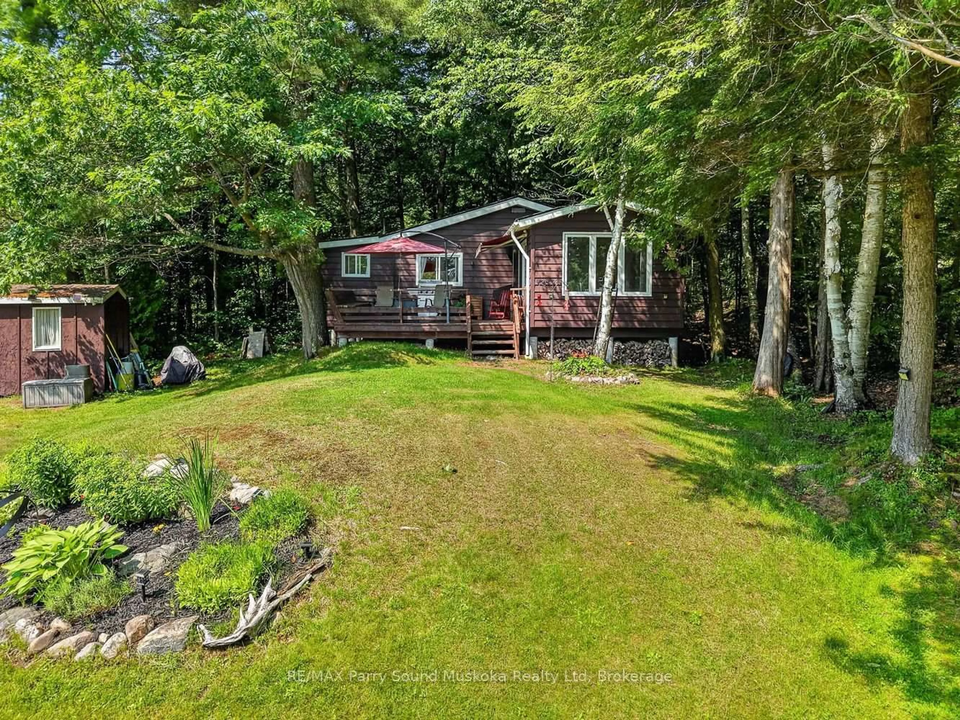 A pic from outside/outdoor area/front of a property/back of a property/a pic from drone, water/lake/river/ocean view for 101 Chain of Lakes Rd, Seguin Ontario P2A 2W9
