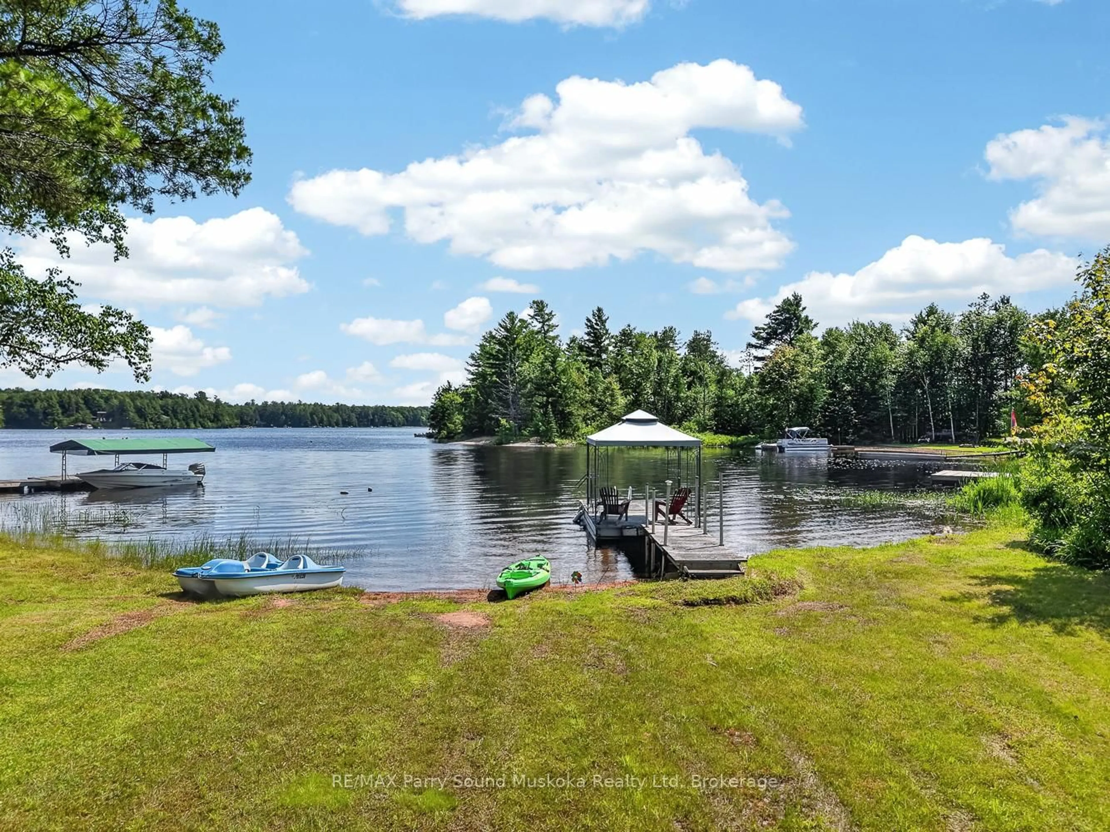 A pic from outside/outdoor area/front of a property/back of a property/a pic from drone, water/lake/river/ocean view for 101 Chain of Lakes Rd, Seguin Ontario P2A 2W9