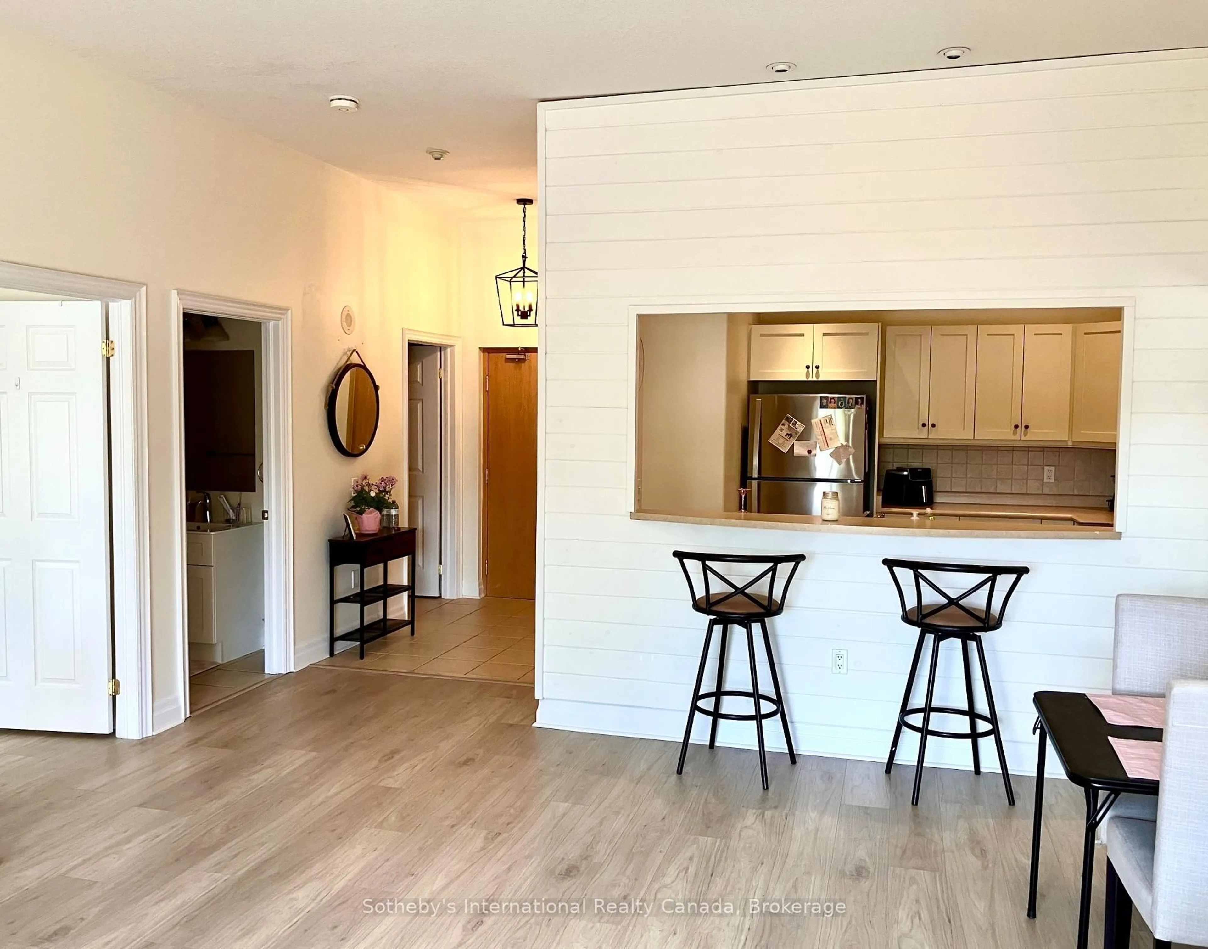 Open concept kitchen, wood/laminate floor for 110 Steamship Bay Rd #102, Gravenhurst Ontario P1P 1Z9