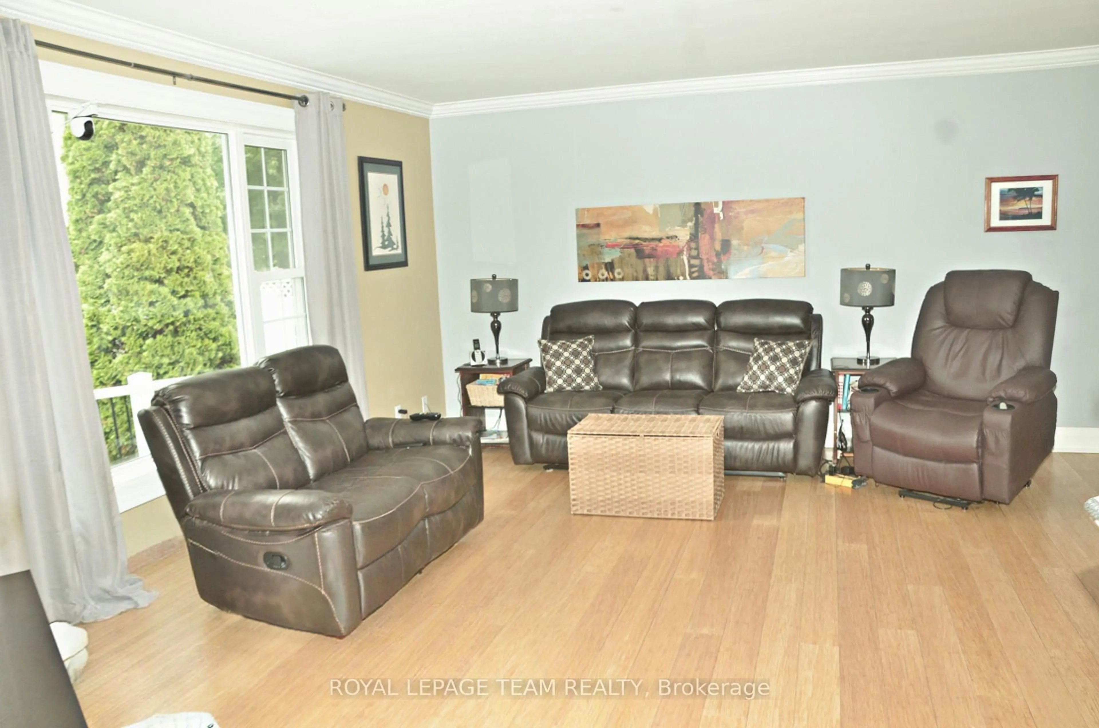 Living room with furniture, wood/laminate floor for 12078 Lakeshore Dr, South Dundas Ontario K0C 1X0