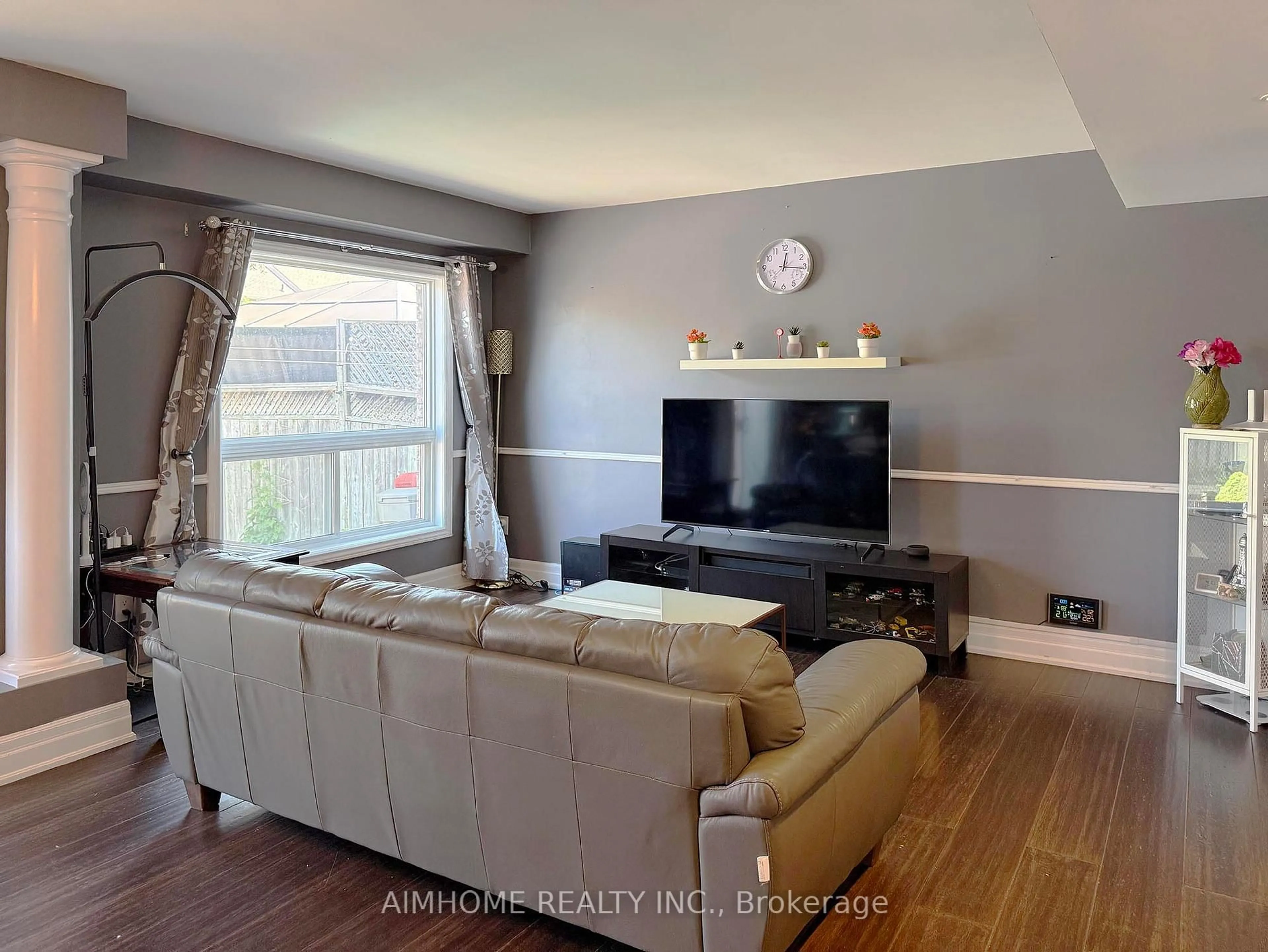 Living room with furniture, wood/laminate floor for 11 Kearney St, Guelph Ontario N1E 7H2