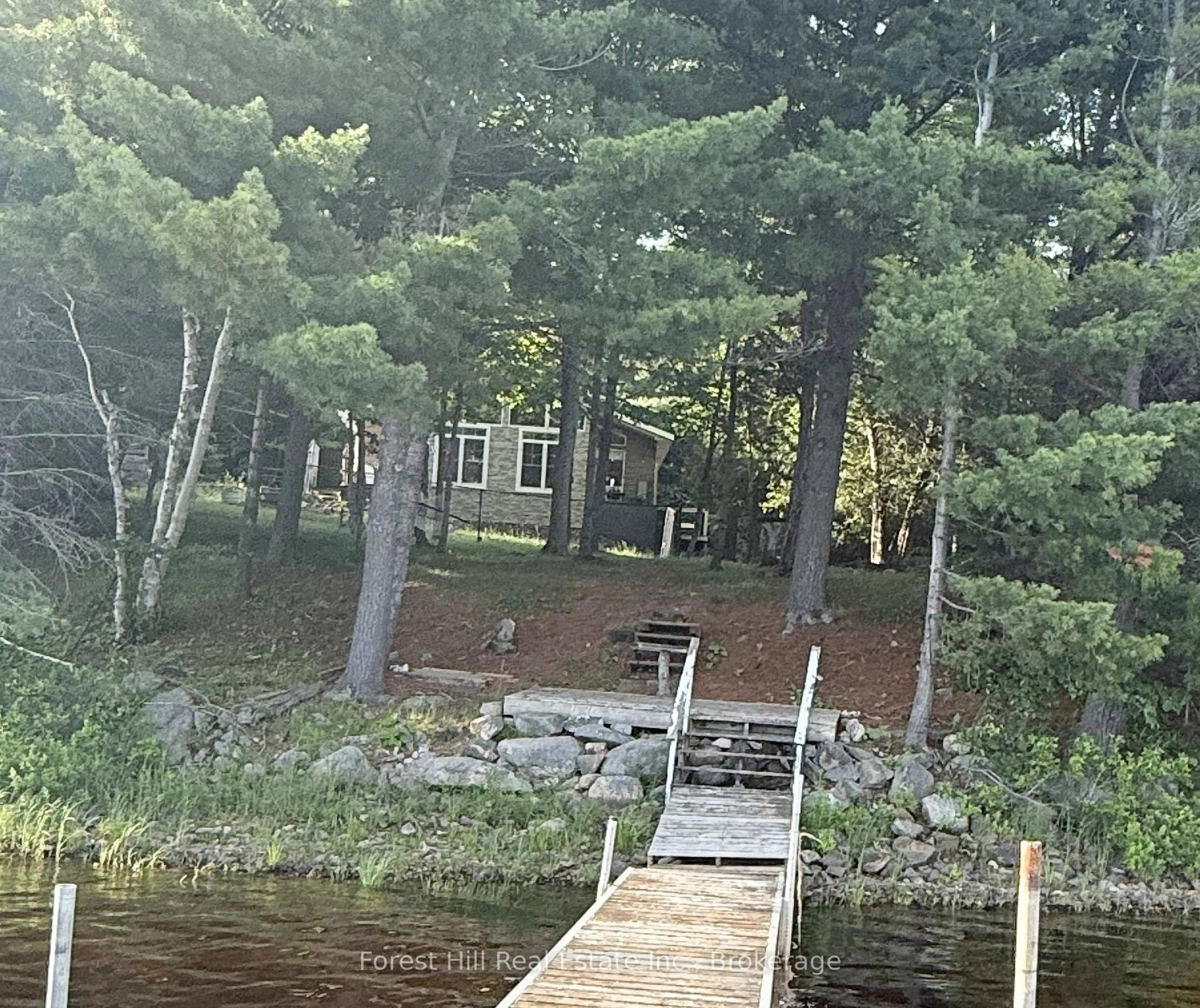 A pic from outside/outdoor area/front of a property/back of a property/a pic from drone, water/lake/river/ocean view for 935 Limberlost Rd, Parry Sound Remote Area Ontario P0H 2R0