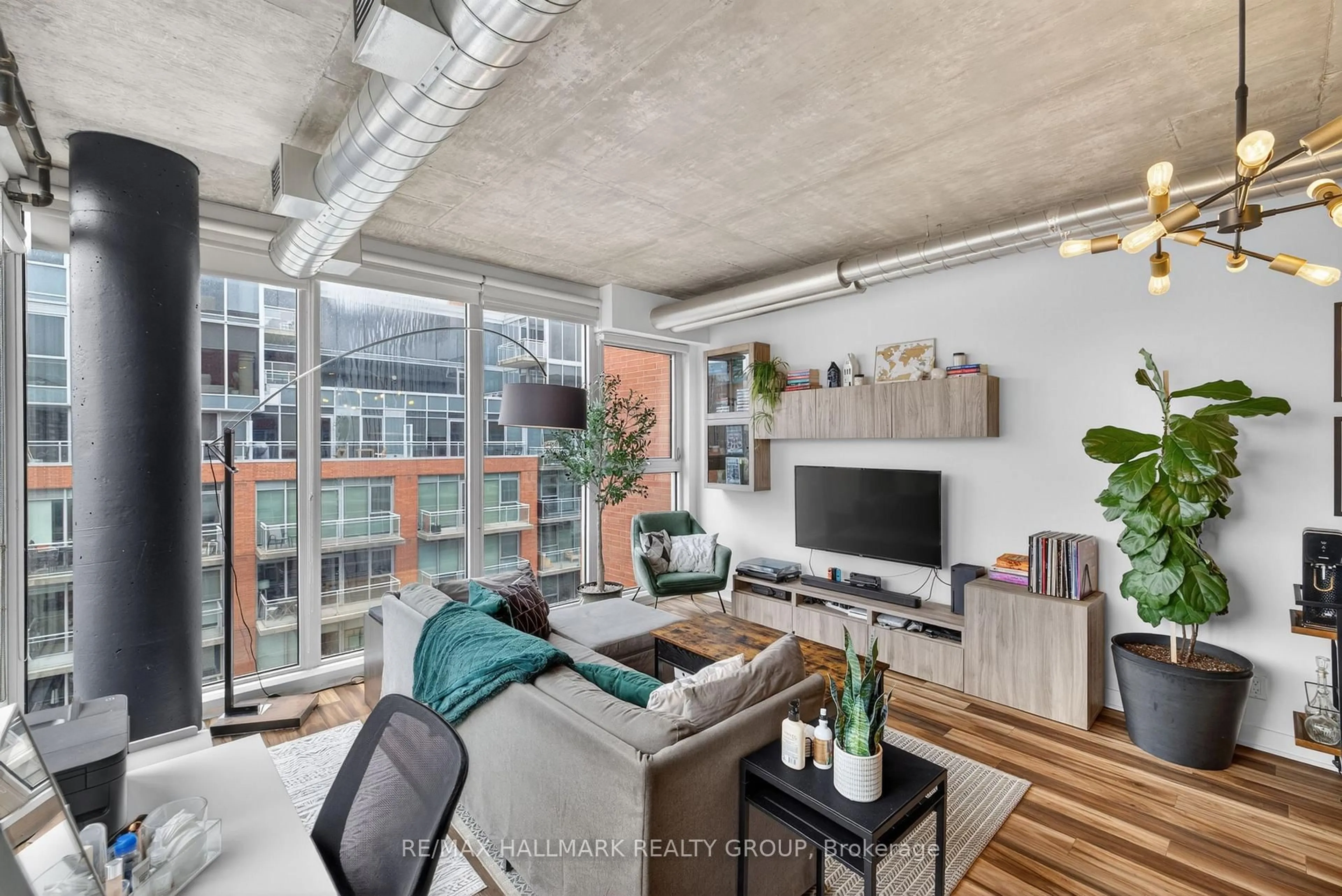 Living room with furniture, cement floor for 349 Mcleod St #634, Ottawa Ontario K2P 0S1