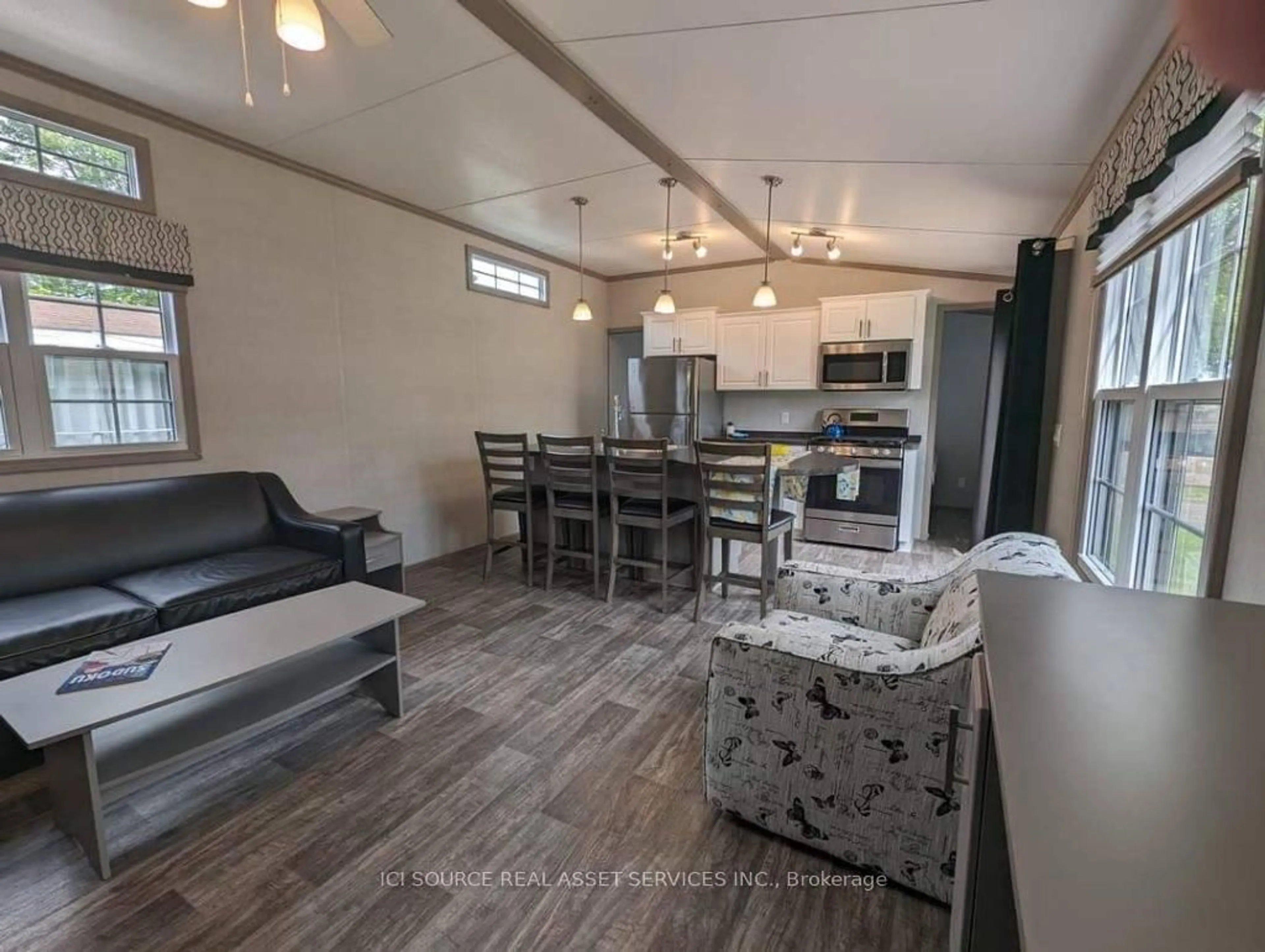 Open concept kitchen, wood/laminate floor for 1082 Shamrock Marina Rd #SMR44, Gravenhurst Ontario P0E 1N0