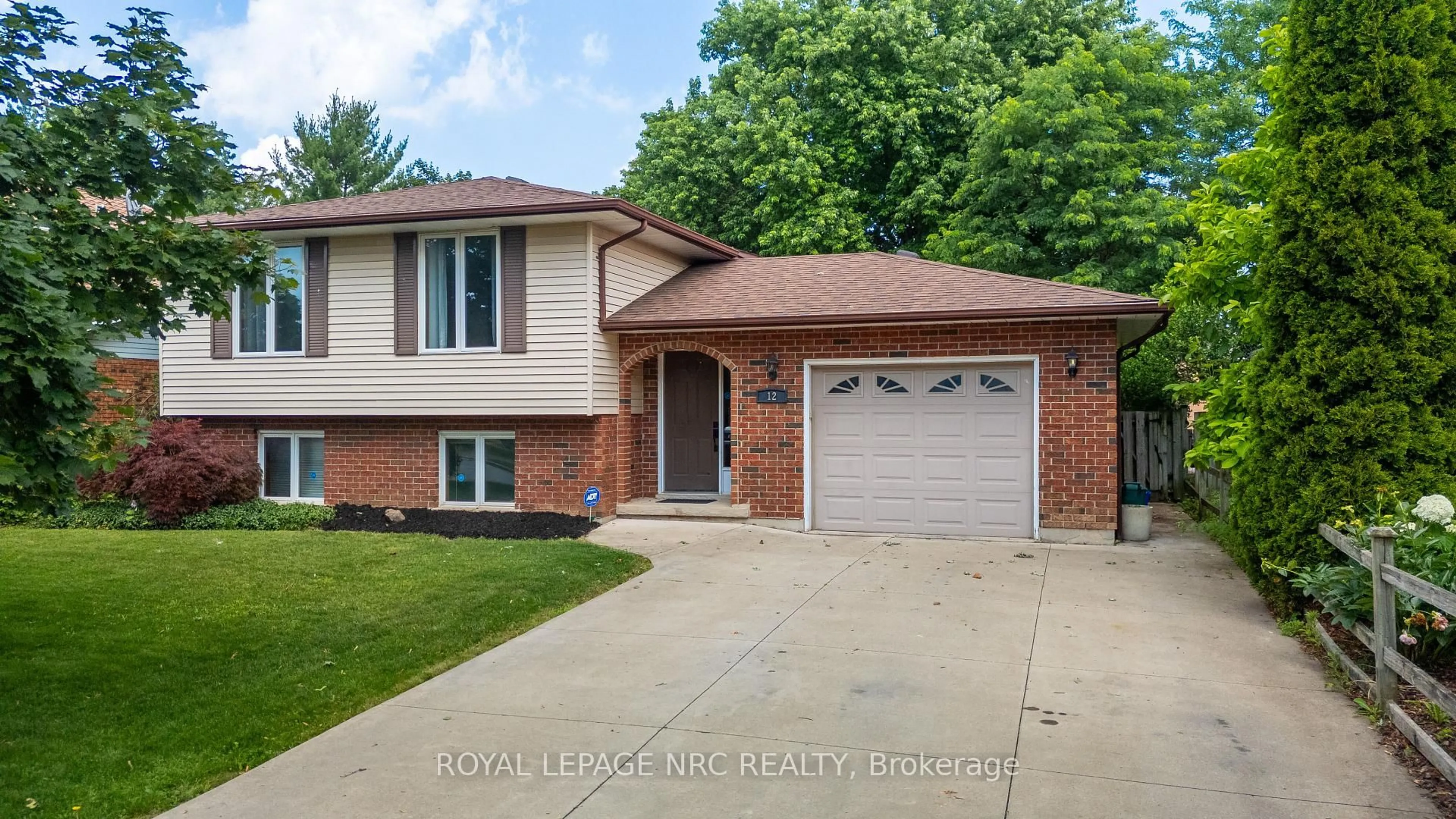 Home with brick exterior material, street for 12 Harvest Oak Dr, St. Catharines Ontario L2S 3H5