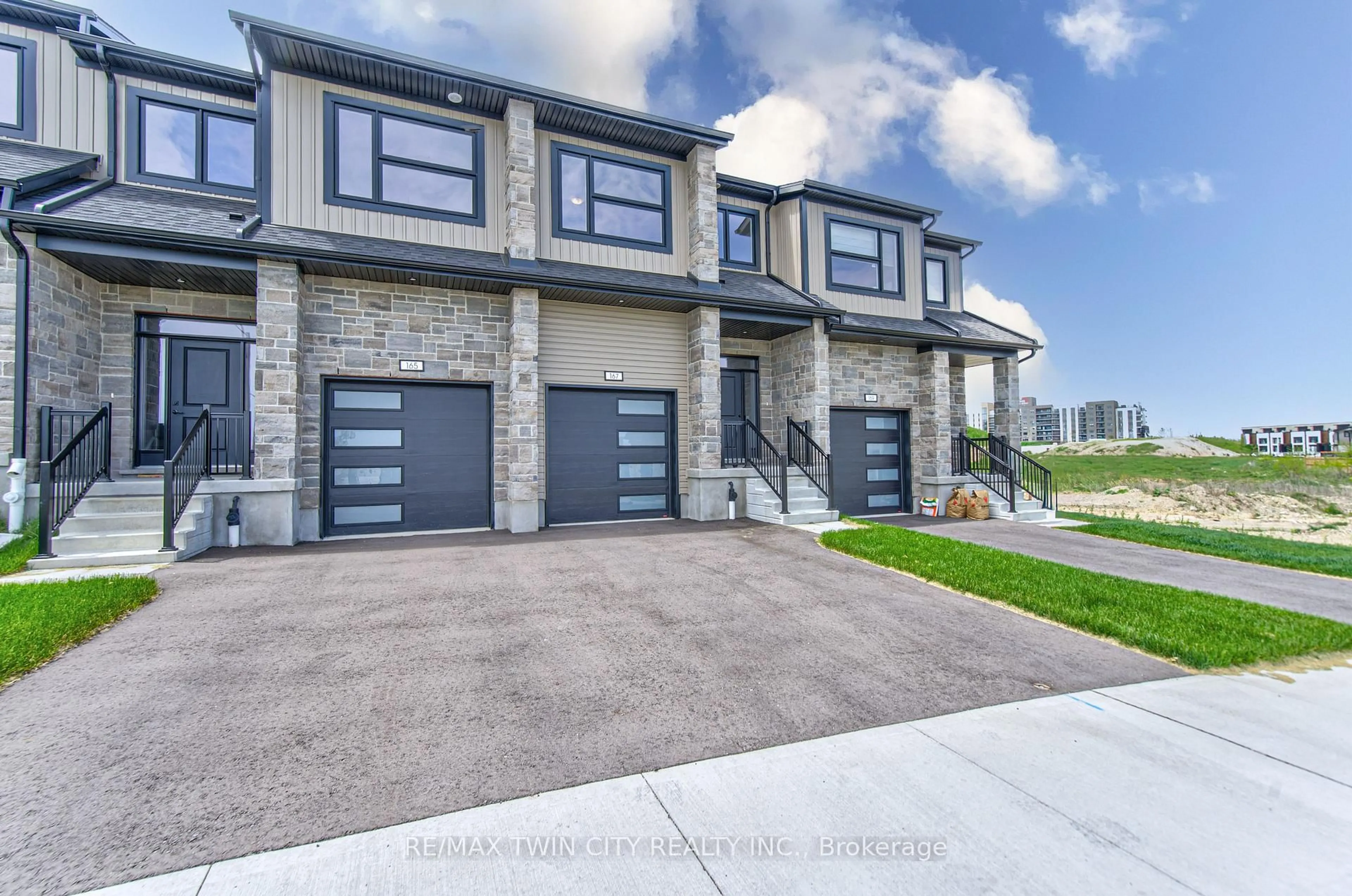 Home with brick exterior material, street for 167 Dunnigan Dr, Kitchener Ontario N2B 0B1