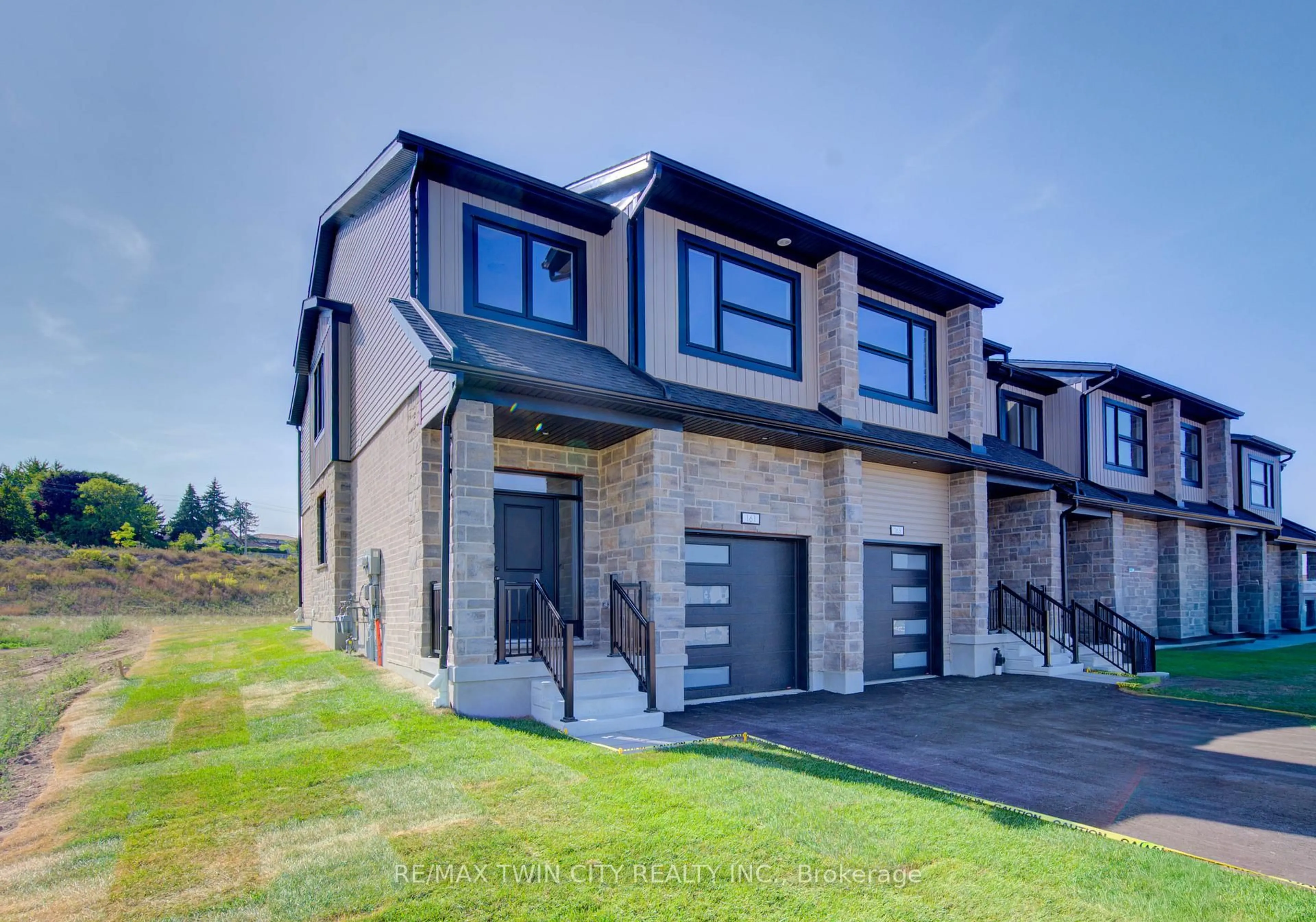 Home with brick exterior material, street for 161 Dunnigan Dr, Kitchener Ontario N2B 0B1