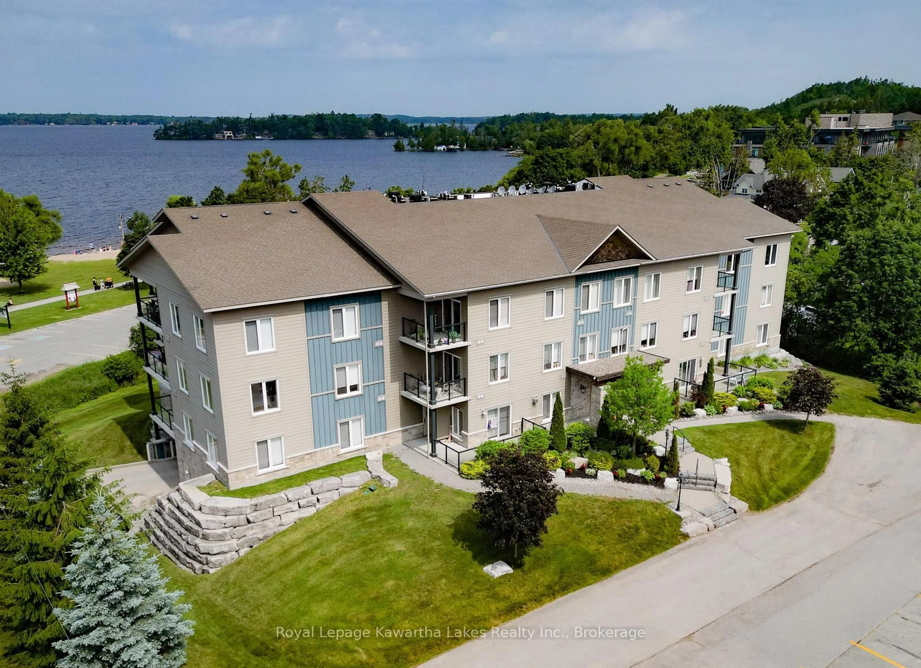 A pic from outside/outdoor area/front of a property/back of a property/a pic from drone, water/lake/river/ocean view for 94 Francis St #308, Kawartha Lakes Ontario K0M 1N0