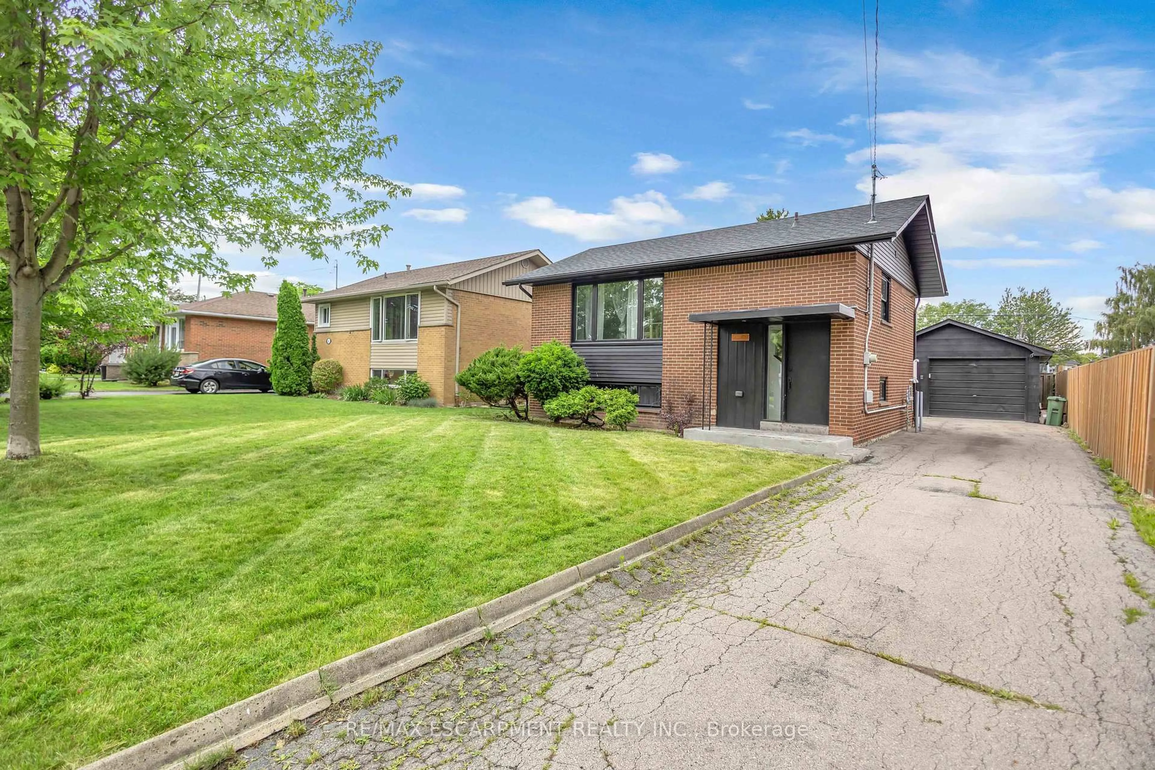 Home with brick exterior material, street for 253 Fernwood Cres, Hamilton Ontario L8T 3L7