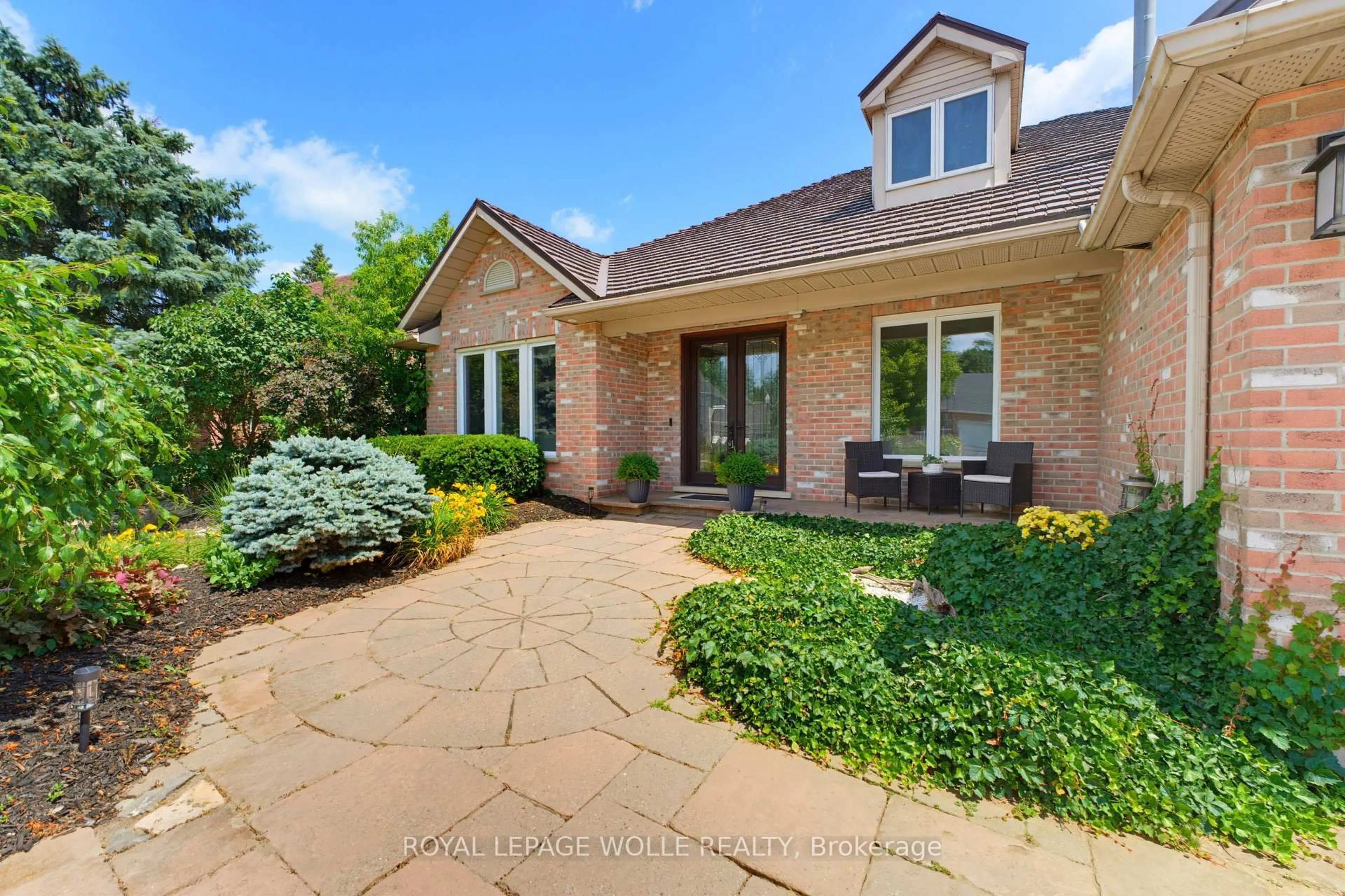 Home with brick exterior material, street for 56 Windrush Tr, Kitchener Ontario N2P 2A8