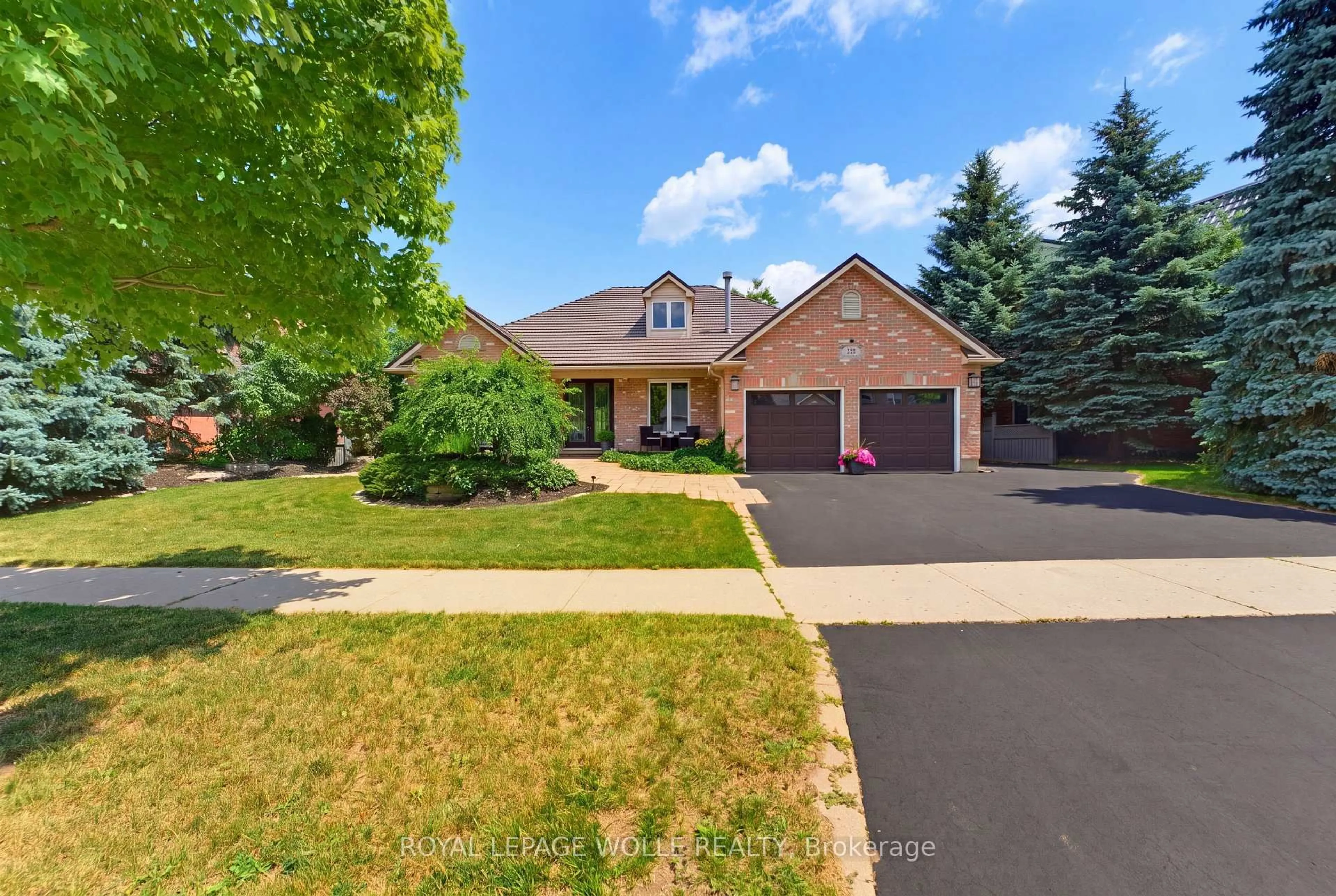 Home with brick exterior material, street for 56 Windrush Tr, Kitchener Ontario N2P 2A8