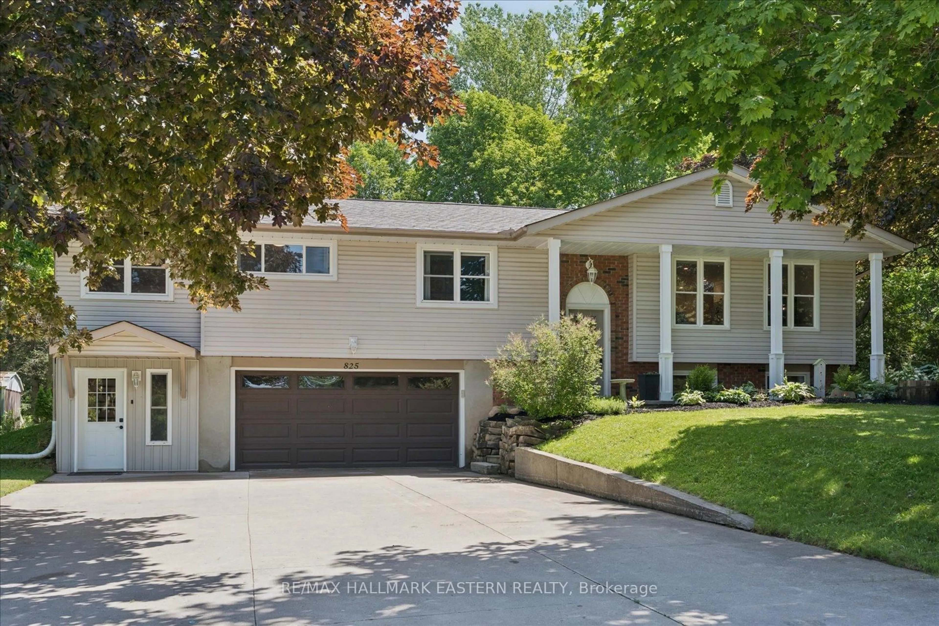 Home with vinyl exterior material, street for 825 Tindle Bay Rd, Selwyn Ontario K9J 6X3