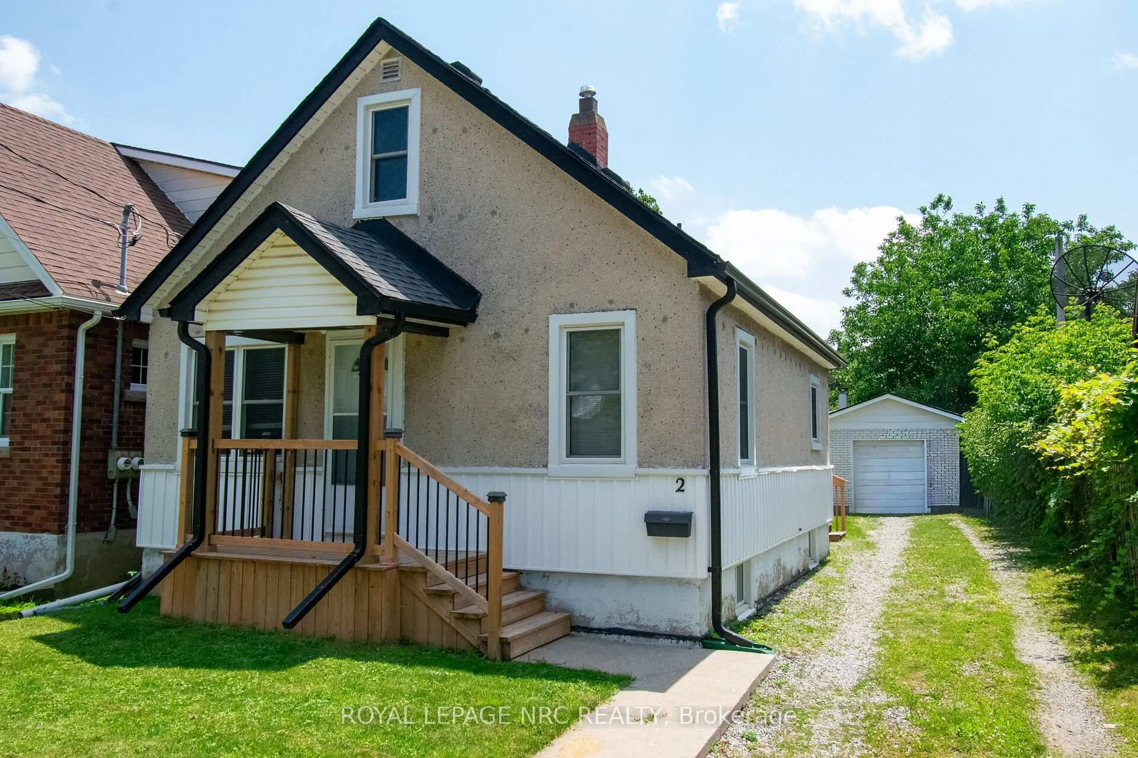 Home with vinyl exterior material, street for 2 Eastbourne Ave, St. Catharines Ontario L2M 5K4
