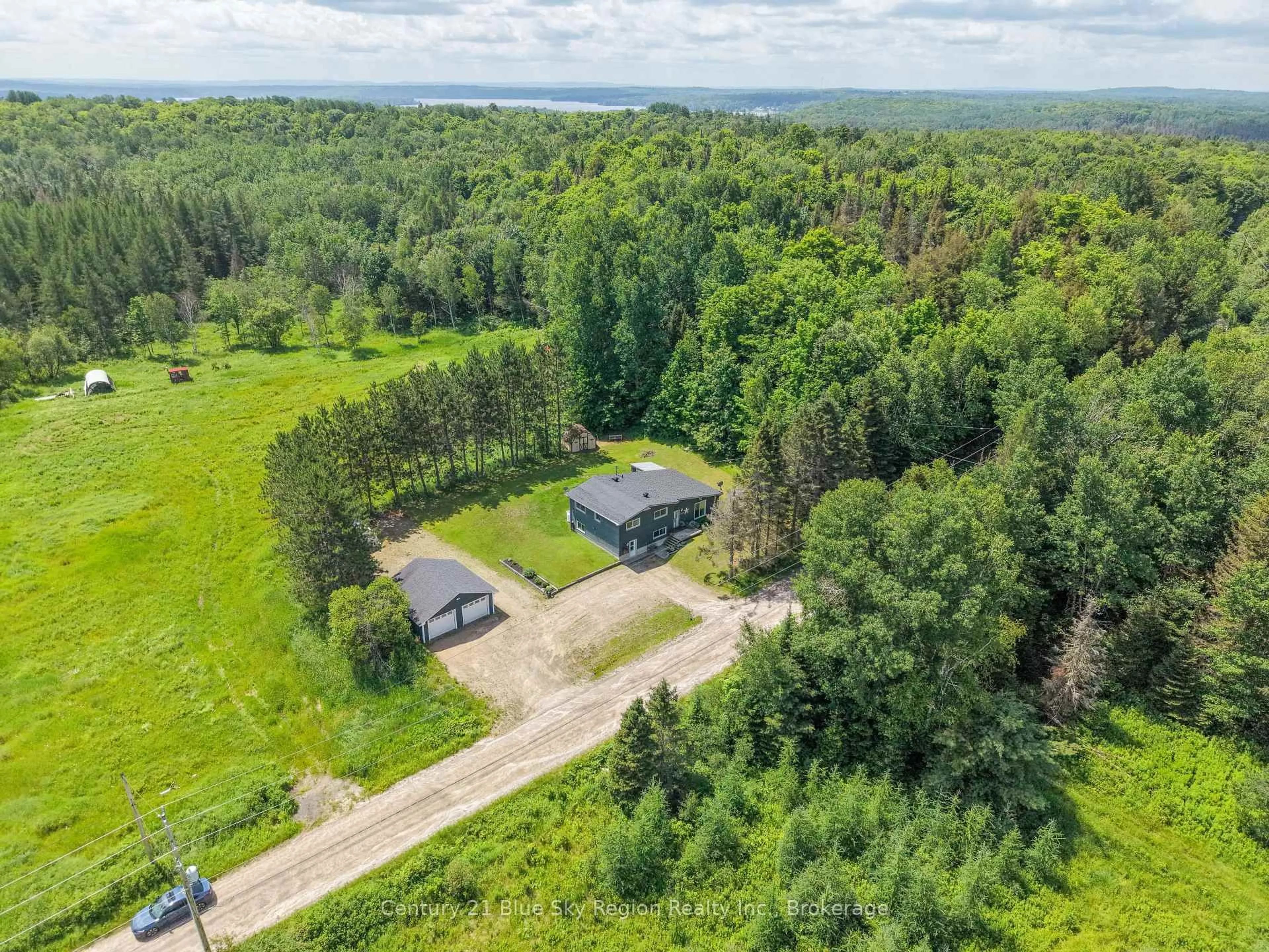 A pic from outside/outdoor area/front of a property/back of a property/a pic from drone, forest/trees view for 128 Hurtubise Rd, East Ferris Ontario P0H 1K0