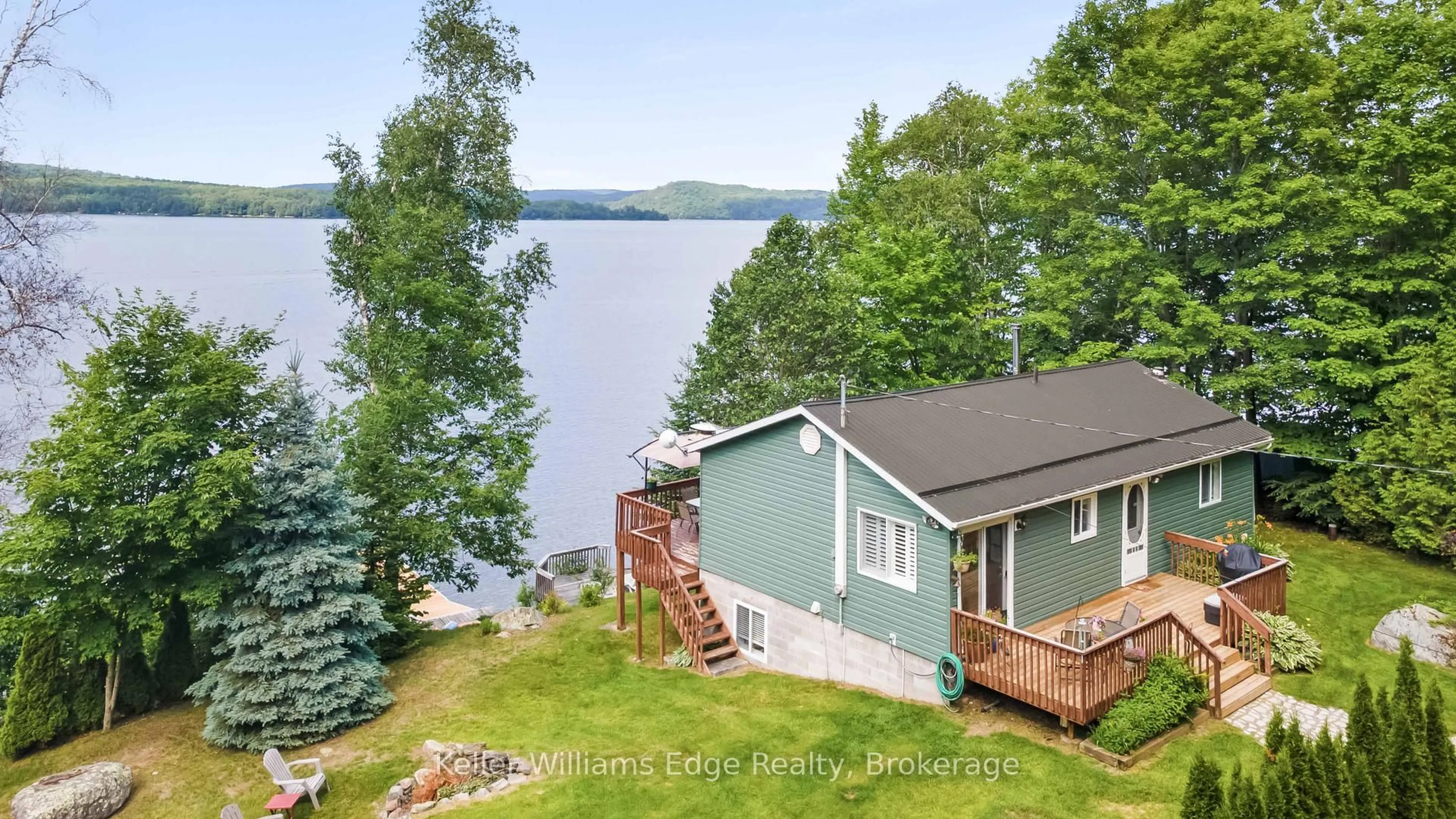 A pic from outside/outdoor area/front of a property/back of a property/a pic from drone, water/lake/river/ocean view for 1128 KAMANISKEG LAKE Rd, Combermere Ontario K0J 1L0