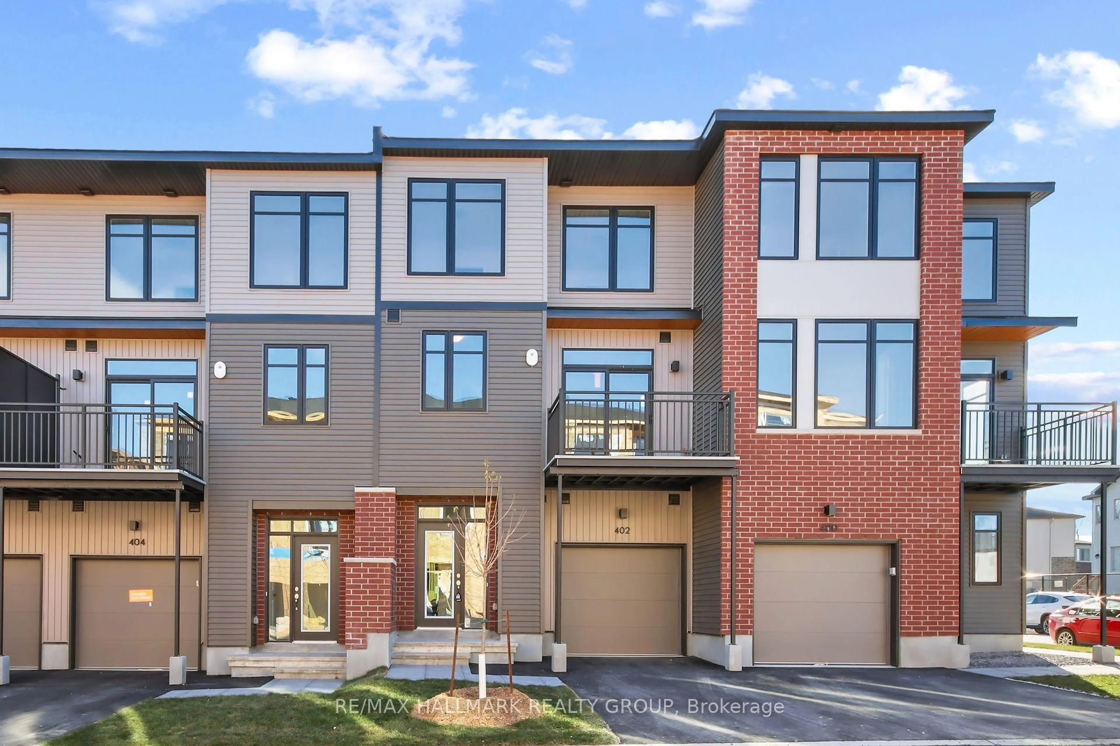 Home with brick exterior material, street for 402 JEWELWING Private, Ottawa Ontario K1X 0M7