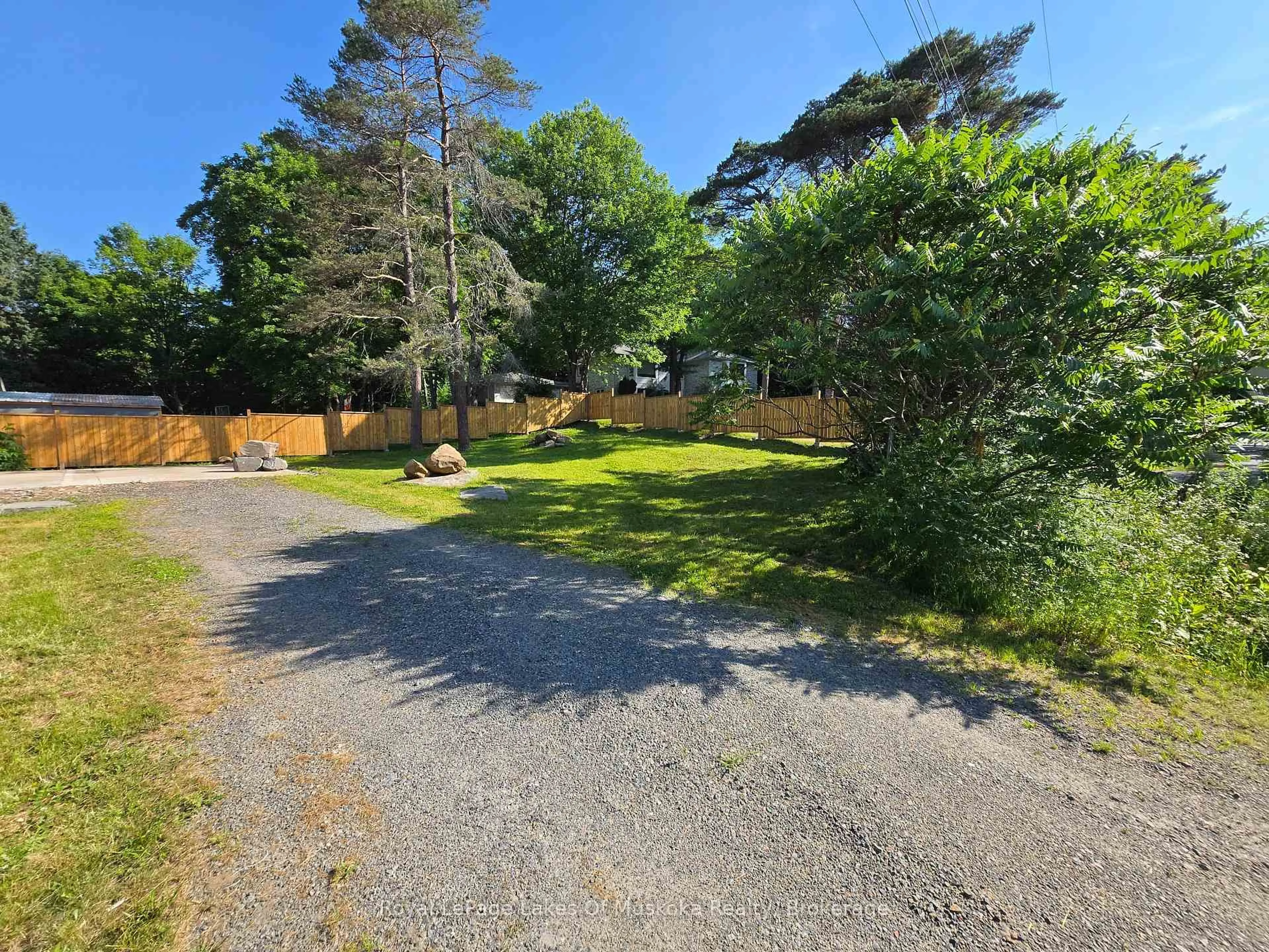 A pic from outside/outdoor area/front of a property/back of a property/a pic from drone, forest/trees view for 11 Silver St, Huntsville Ontario P1H 1M2