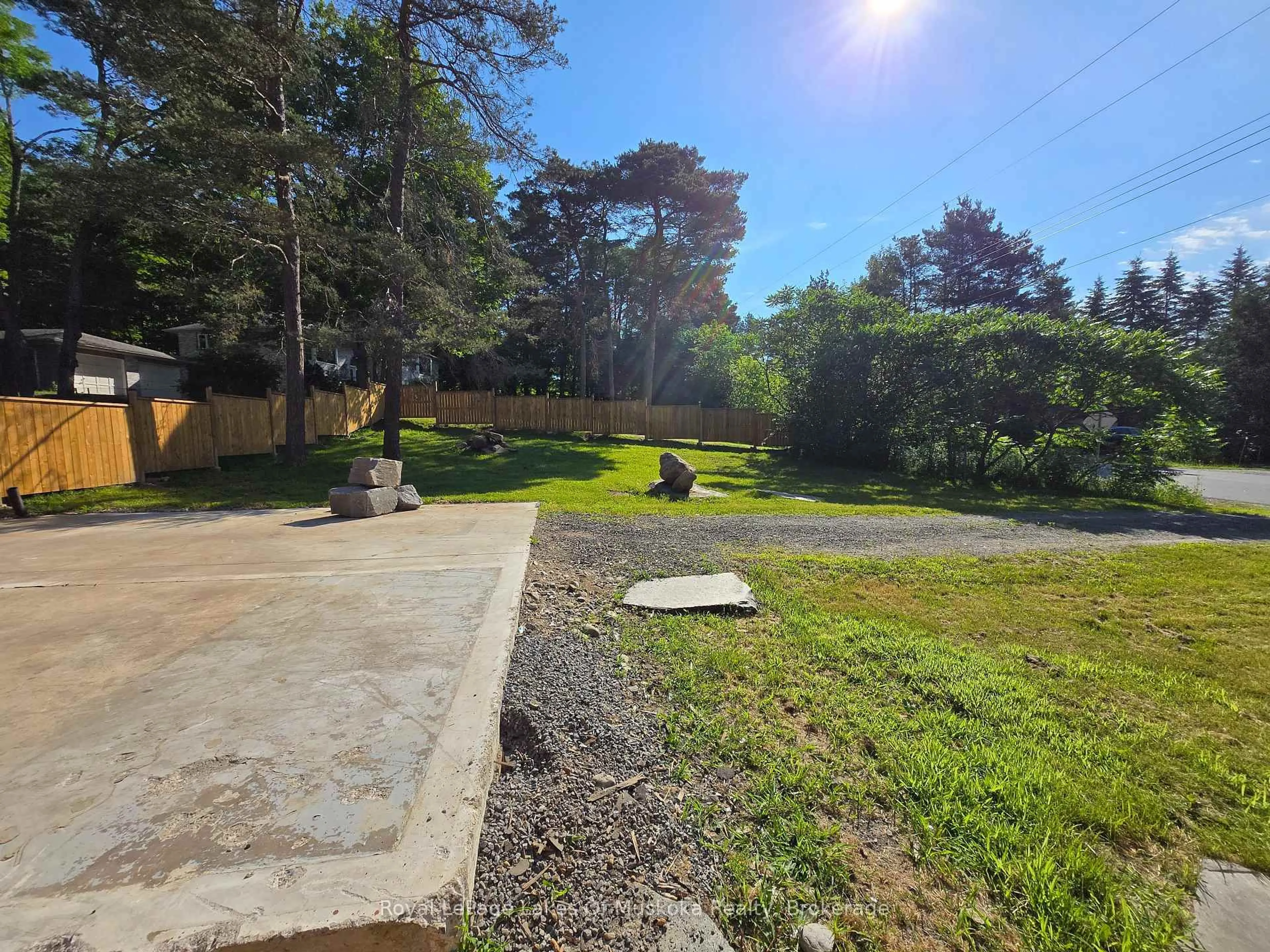 A pic from outside/outdoor area/front of a property/back of a property/a pic from drone, forest/trees view for 11 Silver St, Huntsville Ontario P1H 1M2