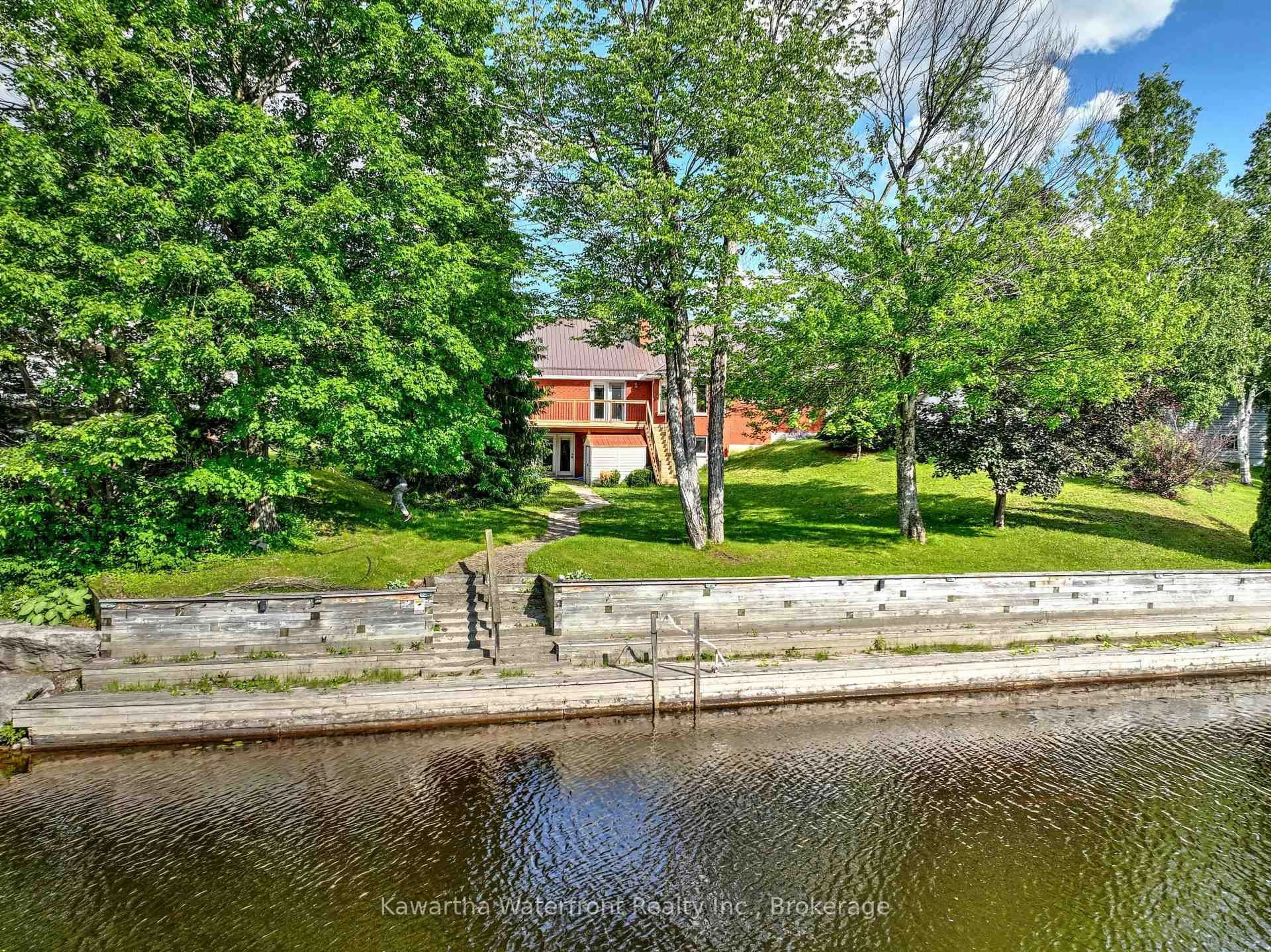 A pic from outside/outdoor area/front of a property/back of a property/a pic from drone, water/lake/river/ocean view for 4 Evans Dr, Kawartha Lakes Ontario K0M 1N0