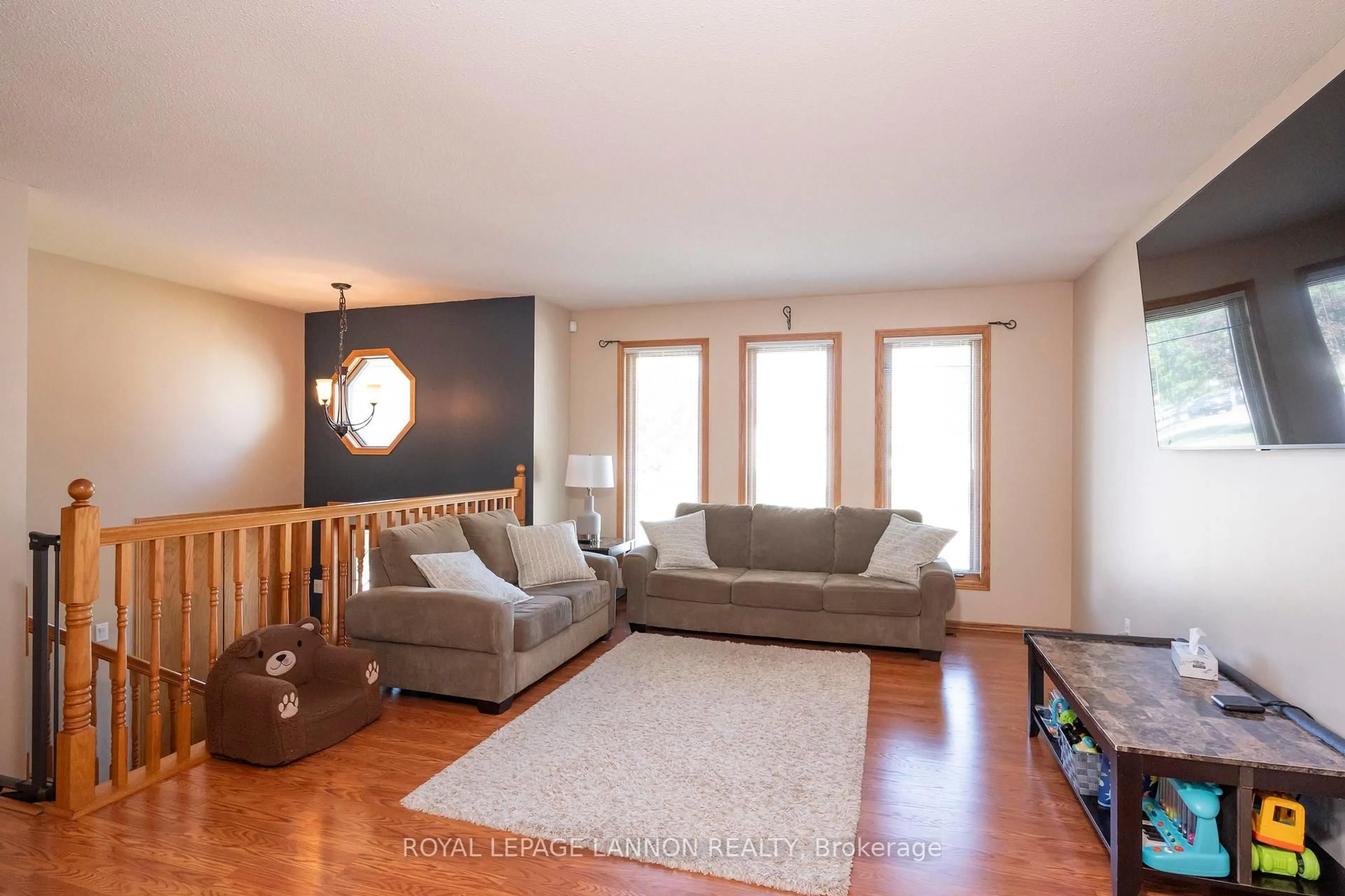 Living room with furniture, wood/laminate floor for 107 Sapphire Dr, Thunder Bay Ontario P7G 1A8