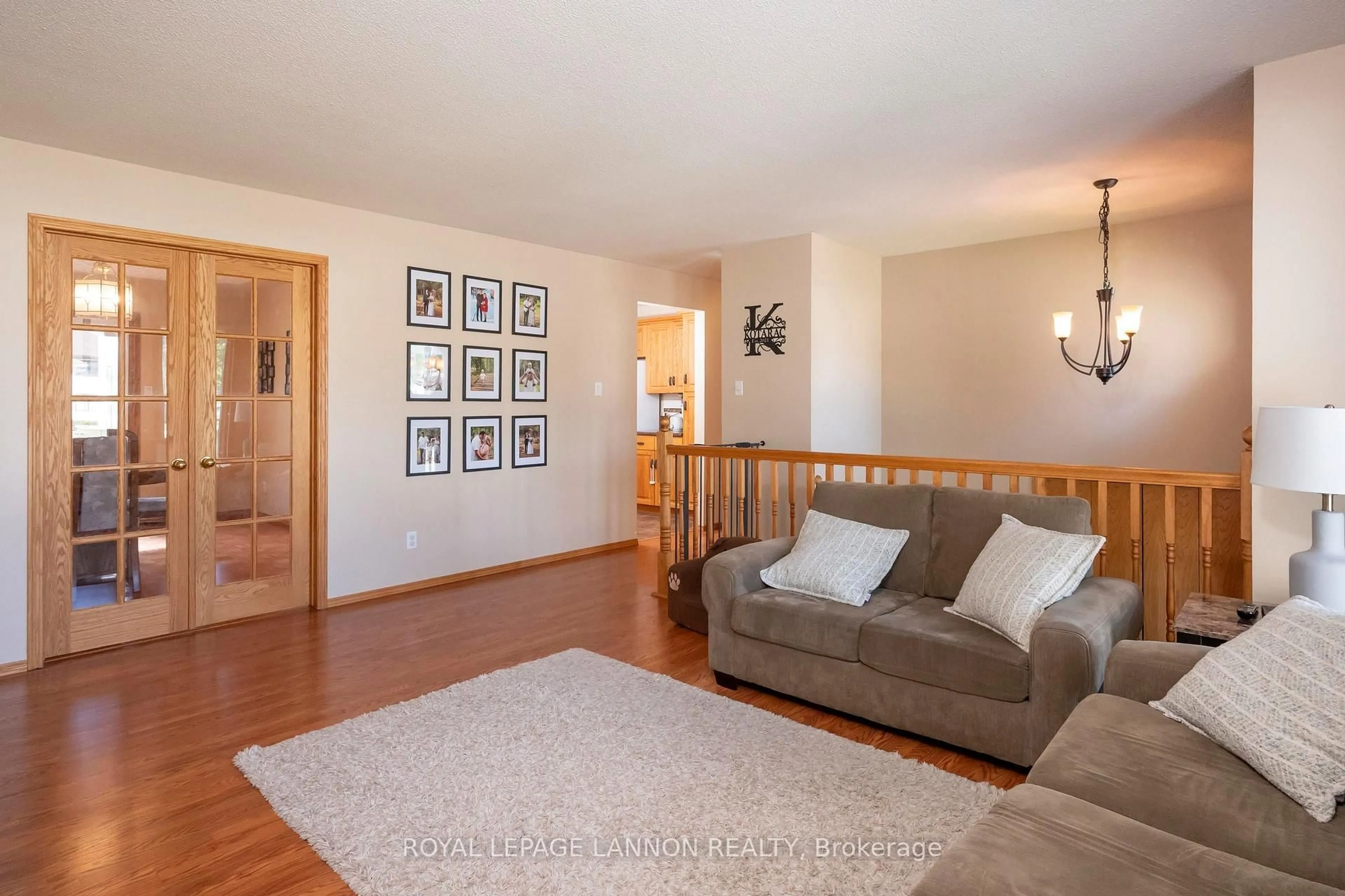 Living room with furniture, wood/laminate floor for 107 Sapphire Dr, Thunder Bay Ontario P7G 1A8